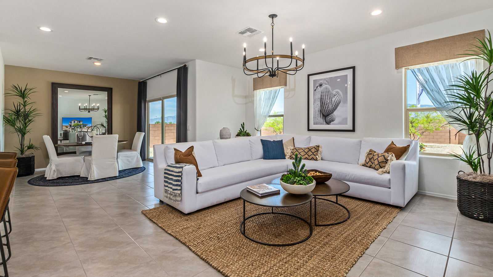 Introducing The Kate, a spacious two-story new home located in the Mesquite neighborhood at Saguaro Bloom, one of Marana's premier communities. This residence, offering 2,264 square feet of living space, is designed to accommodate a variety of lifestyles, with four bedrooms and two and a half bathrooms.  As you enter through the welcoming front porch, you’re immediately drawn into an expansive and open living area. The great room, which flows effortlessly into the dining area and kitchen, serves as the heart of the home, making it perfect for gatherings and everyday living. The kitchen is both functional and stylish, featuring a central island, quartz countertops, and Shaker-style cabinetry. A pantry provides additional storage, keeping your kitchen organized.  Upstairs, The Kate continues to impress with a layout that emphasizes comfort and convenience. The primary bedroom is a peaceful getaway, complete with a walk-in closet and ensuite bathroom. The additional three bedrooms are generously sized and share access to a full bathroom. A dedicated loft provides a flexible space that can be used as a play area, media room, or home office.  The home also includes a powder room on the main level, perfect for guests, and a large utility room upstairs, adding practicality to the daily routine. The covered patio extends your living space outdoors, ideal for enjoying the beautiful Arizona weather.  Built with modern living in mind, The Kate has energy-efficient features, ensuring comfort and sustainability for years to come. Large windows throughout the home allow natural light to brighten every corner, creating a warm and inviting atmosphere.  Situated within the vibrant Saguaro Bloom community, residents have access to many amenities, including swimming pools, walking trails, and parks.   *Images shown are for reference only. They depict the sales model home and may not represent the actual home.