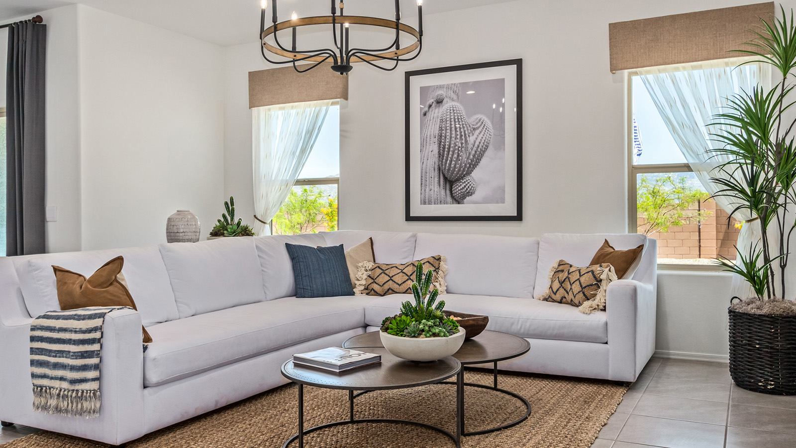 Introducing The Kate, a spacious two-story new home located in the Mesquite neighborhood at Saguaro Bloom, one of Marana's premier communities. This residence, offering 2,264 square feet of living space, is designed to accommodate a variety of lifestyles, with four bedrooms and two and a half bathrooms.  As you enter through the welcoming front porch, you’re immediately drawn into an expansive and open living area. The great room, which flows effortlessly into the dining area and kitchen, serves as the heart of the home, making it perfect for gatherings and everyday living. The kitchen is both functional and stylish, featuring a central island, quartz countertops, and Shaker-style cabinetry. A pantry provides additional storage, keeping your kitchen organized.  Upstairs, The Kate continues to impress with a layout that emphasizes comfort and convenience. The primary bedroom is a peaceful getaway, complete with a walk-in closet and ensuite bathroom. The additional three bedrooms are generously sized and share access to a full bathroom. A dedicated loft provides a flexible space that can be used as a play area, media room, or home office.  The home also includes a powder room on the main level, perfect for guests, and a large utility room upstairs, adding practicality to the daily routine. The covered patio extends your living space outdoors, ideal for enjoying the beautiful Arizona weather.  Built with modern living in mind, The Kate has energy-efficient features, ensuring comfort and sustainability for years to come. Large windows throughout the home allow natural light to brighten every corner, creating a warm and inviting atmosphere.  Situated within the vibrant Saguaro Bloom community, residents have access to many amenities, including swimming pools, walking trails, and parks.   *Images shown are for reference only. They depict the sales model home and may not represent the actual home.