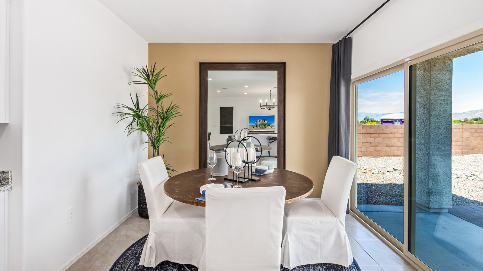 Introducing The Kate, a spacious two-story new home located in the Mesquite neighborhood at Saguaro Bloom, one of Marana's premier communities. This residence, offering 2,264 square feet of living space, is designed to accommodate a variety of lifestyles, with four bedrooms and two and a half bathrooms.  As you enter through the welcoming front porch, you’re immediately drawn into an expansive and open living area. The great room, which flows effortlessly into the dining area and kitchen, serves as the heart of the home, making it perfect for gatherings and everyday living. The kitchen is both functional and stylish, featuring a central island, quartz countertops, and Shaker-style cabinetry. A pantry provides additional storage, keeping your kitchen organized.  Upstairs, The Kate continues to impress with a layout that emphasizes comfort and convenience. The primary bedroom is a peaceful getaway, complete with a walk-in closet and ensuite bathroom. The additional three bedrooms are generously sized and share access to a full bathroom. A dedicated loft provides a flexible space that can be used as a play area, media room, or home office.  The home also includes a powder room on the main level, perfect for guests, and a large utility room upstairs, adding practicality to the daily routine. The covered patio extends your living space outdoors, ideal for enjoying the beautiful Arizona weather.  Built with modern living in mind, The Kate has energy-efficient features, ensuring comfort and sustainability for years to come. Large windows throughout the home allow natural light to brighten every corner, creating a warm and inviting atmosphere.  Situated within the vibrant Saguaro Bloom community, residents have access to many amenities, including swimming pools, walking trails, and parks.   *Images shown are for reference only. They depict the sales model home and may not represent the actual home.