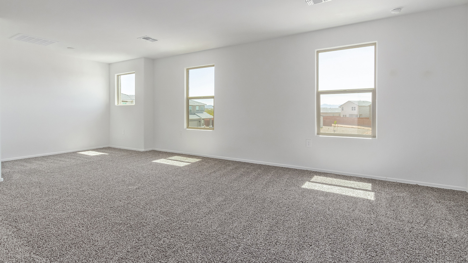 Welcome to The Madison, a generously sized two-story home located in the Mesquite neighborhood of Saguaro Bloom. With 2,522 square feet of living space, this home is designed to accommodate a variety of lifestyles, featuring five bedrooms and three full bathrooms.  As you step into the charming front porch, you are greeted by a spacious and open floor plan that seamlessly connects the main living areas. The great room serves as the central hub of the home, flowing into a dining area and modern kitchen area. The kitchen features a large central island, quartz countertops, Shaker-style cabinetry, walk-in pantry, and ample storage for all your culinary needs.  The first floor also includes a guest bedroom and a full bathroom, offering convenience and flexibility for visitors or family members.   Upstairs, The Madison continues to impress with a thoughtful layout that includes four additional bedrooms. The primary bedroom offers plenty of space ensuite a private bathroom and large walk-in closet. The loft area provides an additional living space that can be used as a game room, media center, or study, adding versatility to the home’s design.  A covered patio extends your living space outdoors, making it the perfect spot for enjoying the Arizona weather, whether you’re hosting a gathering or relaxing in the evening. The two-car garage provides ample space for vehicles and additional storage.  The Madison is equipped with modern, energy-efficient features and smart home technology, ensuring a comfortable and sustainable lifestyle for years to come. Large windows throughout the home allow natural light to fill the space, creating a warm and welcoming atmosphere.  Located in the vibrant Saguaro Bloom community, The Madison offers access to a wide range of amenities, including swimming pools, walking trails, parks, and more. This home combines style, comfort, and functionality, making it an excellent choice for those looking to settle in Marana.  *Images shown are for reference only. They depict The Madison model home with virtual staging and may not represent the actual home.