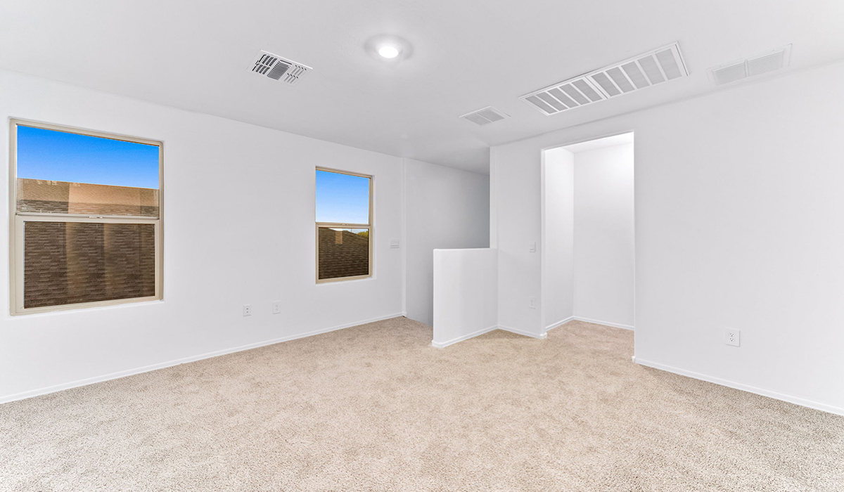Welcome to The Madison, a generously sized two-story home located in the Mesquite neighborhood of Saguaro Bloom. With 2,522 square feet of living space, this home is designed to accommodate a variety of lifestyles, featuring five bedrooms and three full bathrooms.  As you step into the charming front porch, you are greeted by a spacious and open floor plan that seamlessly connects the main living areas. The great room serves as the central hub of the home, flowing into a dining area and modern kitchen area. The kitchen features a large central island, quartz countertops, Shaker-style cabinetry, walk-in pantry, and ample storage for all your culinary needs.  The first floor also includes a guest bedroom and a full bathroom, offering convenience and flexibility for visitors or family members.   Upstairs, The Madison continues to impress with a thoughtful layout that includes four additional bedrooms. The primary bedroom offers plenty of space ensuite a private bathroom and large walk-in closet. The loft area provides an additional living space that can be used as a game room, media center, or study, adding versatility to the home’s design.  A covered patio extends your living space outdoors, making it the perfect spot for enjoying the Arizona weather, whether you’re hosting a gathering or relaxing in the evening. The two-car garage provides ample space for vehicles and additional storage.  The Madison is equipped with modern, energy-efficient features and smart home technology, ensuring a comfortable and sustainable lifestyle for years to come. Large windows throughout the home allow natural light to fill the space, creating a warm and welcoming atmosphere.  Located in the vibrant Saguaro Bloom community, The Madison offers access to a wide range of amenities, including swimming pools, walking trails, parks, and more. This home combines style, comfort, and functionality, making it an excellent choice for those looking to settle in Marana.  *Images shown are for reference only. They depict The Madison spec home and may not represent the actual home.