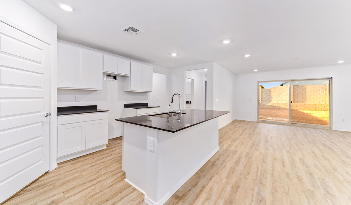 Welcome to The Madison, a generously sized two-story home located in the Mesquite neighborhood of Saguaro Bloom. With 2,522 square feet of living space, this home is designed to accommodate a variety of lifestyles, featuring five bedrooms and three full bathrooms.  As you step into the charming front porch, you are greeted by a spacious and open floor plan that seamlessly connects the main living areas. The great room serves as the central hub of the home, flowing into a dining area and modern kitchen area. The kitchen features a large central island, quartz countertops, Shaker-style cabinetry, walk-in pantry, and ample storage for all your culinary needs.  The first floor also includes a guest bedroom and a full bathroom, offering convenience and flexibility for visitors or family members.   Upstairs, The Madison continues to impress with a thoughtful layout that includes four additional bedrooms. The primary bedroom offers plenty of space ensuite a private bathroom and large walk-in closet. The loft area provides an additional living space that can be used as a game room, media center, or study, adding versatility to the home’s design.  A covered patio extends your living space outdoors, making it the perfect spot for enjoying the Arizona weather, whether you’re hosting a gathering or relaxing in the evening. The two-car garage provides ample space for vehicles and additional storage.  The Madison is equipped with modern, energy-efficient features and smart home technology, ensuring a comfortable and sustainable lifestyle for years to come. Large windows throughout the home allow natural light to fill the space, creating a warm and welcoming atmosphere.  Located in the vibrant Saguaro Bloom community, The Madison offers access to a wide range of amenities, including swimming pools, walking trails, parks, and more. This home combines style, comfort, and functionality, making it an excellent choice for those looking to settle in Marana.  *Images shown are for reference only. They depict the Madison model home and may not represent the actual home.