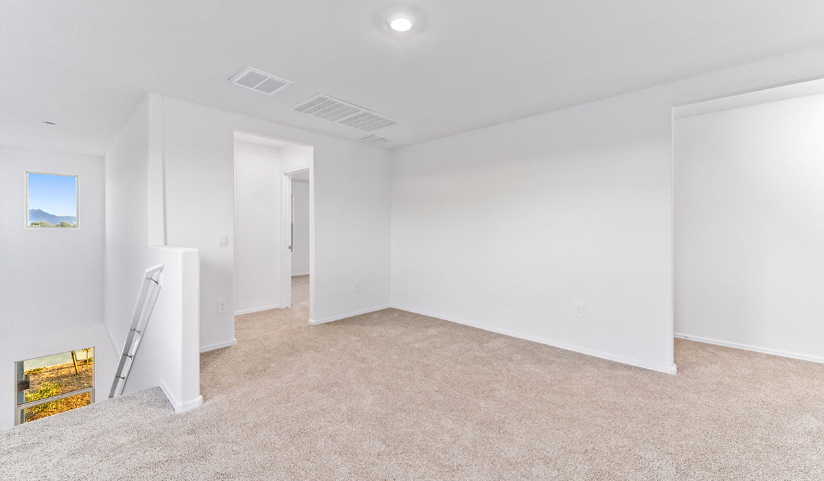 Welcome to The Madison, a generously sized two-story home located in the Mesquite neighborhood of Saguaro Bloom. With 2,522 square feet of living space, this home is designed to accommodate a variety of lifestyles, featuring five bedrooms and three full bathrooms.  As you step into the charming front porch, you are greeted by a spacious and open floor plan that seamlessly connects the main living areas. The great room serves as the central hub of the home, flowing into a dining area and modern kitchen area. The kitchen features a large central island, quartz countertops, Shaker-style cabinetry, walk-in pantry, and ample storage for all your culinary needs.  The first floor also includes a guest bedroom and a full bathroom, offering convenience and flexibility for visitors or family members.   Upstairs, The Madison continues to impress with a thoughtful layout that includes four additional bedrooms. The primary bedroom offers plenty of space ensuite a private bathroom and large walk-in closet. The loft area provides an additional living space that can be used as a game room, media center, or study, adding versatility to the home’s design.  A covered patio extends your living space outdoors, making it the perfect spot for enjoying the Arizona weather, whether you’re hosting a gathering or relaxing in the evening. The two-car garage provides ample space for vehicles and additional storage.  The Madison is equipped with modern, energy-efficient features and smart home technology, ensuring a comfortable and sustainable lifestyle for years to come. Large windows throughout the home allow natural light to fill the space, creating a warm and welcoming atmosphere.  Located in the vibrant Saguaro Bloom community, The Madison offers access to a wide range of amenities, including swimming pools, walking trails, parks, and more. This home combines style, comfort, and functionality, making it an excellent choice for those looking to settle in Marana.  *Images shown are for reference only. They depict the Madison model home and may not represent the actual home.