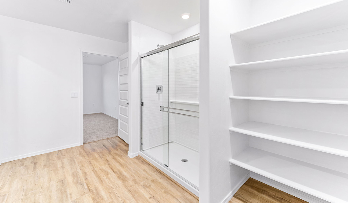 Welcome to The Madison, a generously sized two-story home located in the Mesquite neighborhood of Saguaro Bloom. With 2,522 square feet of living space, this home is designed to accommodate a variety of lifestyles, featuring five bedrooms and three full bathrooms.  As you step into the charming front porch, you are greeted by a spacious and open floor plan that seamlessly connects the main living areas. The great room serves as the central hub of the home, flowing into a dining area and modern kitchen area. The kitchen features a large central island, quartz countertops, Shaker-style cabinetry, walk-in pantry, and ample storage for all your culinary needs.  The first floor also includes a guest bedroom and a full bathroom, offering convenience and flexibility for visitors or family members.   Upstairs, The Madison continues to impress with a thoughtful layout that includes four additional bedrooms. The primary bedroom offers plenty of space ensuite a private bathroom and large walk-in closet. The loft area provides an additional living space that can be used as a game room, media center, or study, adding versatility to the home’s design.  A covered patio extends your living space outdoors, making it the perfect spot for enjoying the Arizona weather, whether you’re hosting a gathering or relaxing in the evening. The two-car garage provides ample space for vehicles and additional storage.  The Madison is equipped with modern, energy-efficient features and smart home technology, ensuring a comfortable and sustainable lifestyle for years to come. Large windows throughout the home allow natural light to fill the space, creating a warm and welcoming atmosphere.  Located in the vibrant Saguaro Bloom community, The Madison offers access to a wide range of amenities, including swimming pools, walking trails, parks, and more. This home combines style, comfort, and functionality, making it an excellent choice for those looking to settle in Marana.  *Images shown are for reference only. They depict the Madison model home and may not represent the actual home.