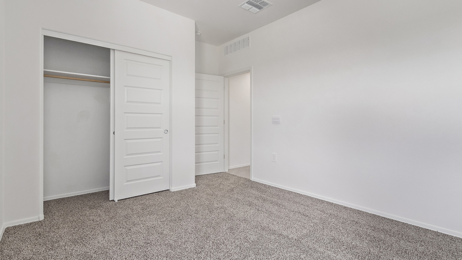 Welcome to The Madison, a generously sized two-story home located in the Mesquite neighborhood of Saguaro Bloom. With 2,522 square feet of living space, this home is designed to accommodate a variety of lifestyles, featuring five bedrooms and three full bathrooms.  As you step into the charming front porch, you are greeted by a spacious and open floor plan that seamlessly connects the main living areas. The great room serves as the central hub of the home, flowing into a dining area and modern kitchen area. The kitchen features a large central island, quartz countertops, Shaker-style cabinetry, walk-in pantry, and ample storage for all your culinary needs.  The first floor also includes a guest bedroom and a full bathroom, offering convenience and flexibility for visitors or family members.   Upstairs, The Madison continues to impress with a thoughtful layout that includes four additional bedrooms. The primary bedroom offers plenty of space ensuite a private bathroom and large walk-in closet. The loft area provides an additional living space that can be used as a game room, media center, or study, adding versatility to the home’s design.  A covered patio extends your living space outdoors, making it the perfect spot for enjoying the Arizona weather, whether you’re hosting a gathering or relaxing in the evening. The two-car garage provides ample space for vehicles and additional storage.  The Madison is equipped with modern, energy-efficient features and smart home technology, ensuring a comfortable and sustainable lifestyle for years to come. Large windows throughout the home allow natural light to fill the space, creating a warm and welcoming atmosphere.  Located in the vibrant Saguaro Bloom community, The Madison offers access to a wide range of amenities, including swimming pools, walking trails, parks, and more. This home combines style, comfort, and functionality, making it an excellent choice for those looking to settle in Marana.