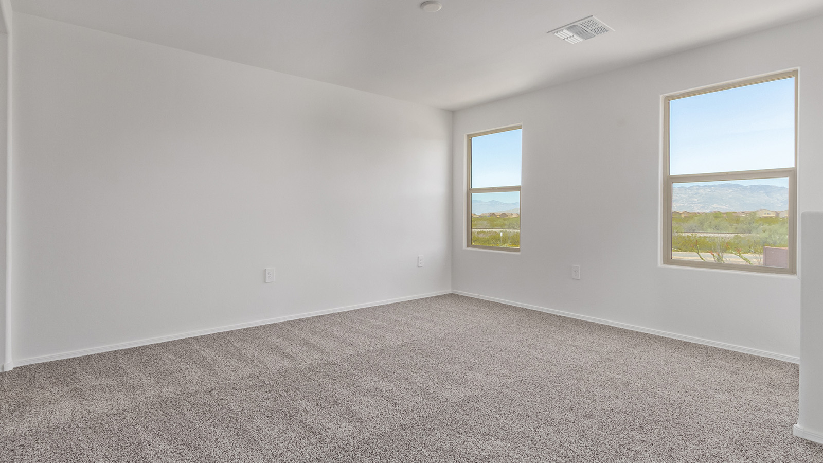 Welcome to The Madison, a generously sized two-story home located in the Mesquite neighborhood of Saguaro Bloom. With 2,522 square feet of living space, this home is designed to accommodate a variety of lifestyles, featuring five bedrooms and three full bathrooms.  As you step into the charming front porch, you are greeted by a spacious and open floor plan that seamlessly connects the main living areas. The great room serves as the central hub of the home, flowing into a dining area and modern kitchen area. The kitchen features a large central island, quartz countertops, Shaker-style cabinetry, walk-in pantry, and ample storage for all your culinary needs.  The first floor also includes a guest bedroom and a full bathroom, offering convenience and flexibility for visitors or family members.   Upstairs, The Madison continues to impress with a thoughtful layout that includes four additional bedrooms. The primary bedroom offers plenty of space ensuite a private bathroom and large walk-in closet. The loft area provides an additional living space that can be used as a game room, media center, or study, adding versatility to the home’s design.  A covered patio extends your living space outdoors, making it the perfect spot for enjoying the Arizona weather, whether you’re hosting a gathering or relaxing in the evening. The two-car garage provides ample space for vehicles and additional storage.  The Madison is equipped with modern, energy-efficient features and smart home technology, ensuring a comfortable and sustainable lifestyle for years to come. Large windows throughout the home allow natural light to fill the space, creating a warm and welcoming atmosphere.  Located in the vibrant Saguaro Bloom community, The Madison offers access to a wide range of amenities, including swimming pools, walking trails, parks, and more. This home combines style, comfort, and functionality, making it an excellent choice for those looking to settle in Marana.