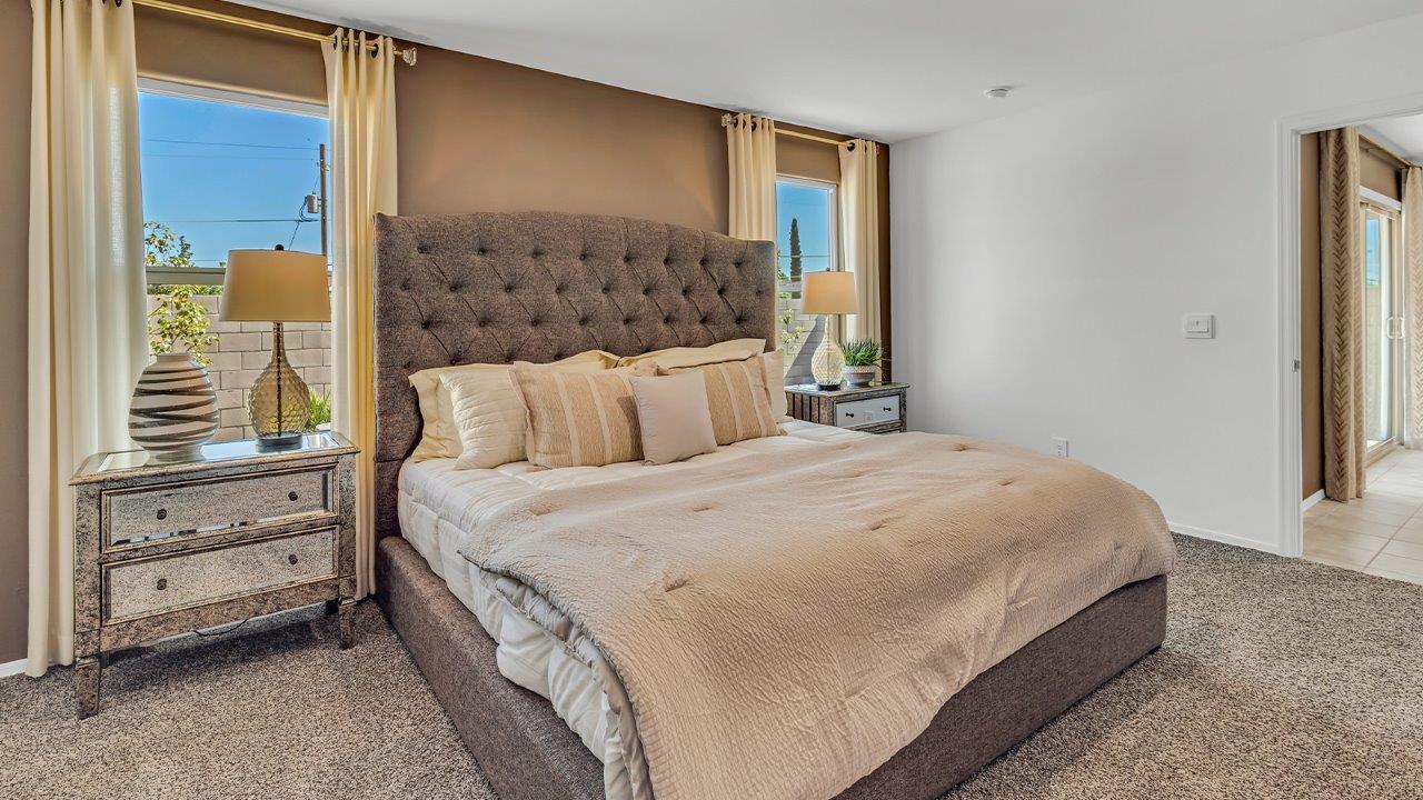 Welcome to the Gaven plan, a spacious single-story new home within Saguaro Bloom, where modern living meets the serene beauty of the Arizona landscape. This thoughtfully crafted residence offers 1,815 square feet of well-designed living space, featuring four bedrooms and two full bathrooms, perfect for families who value both comfort and style. As you step through the front door, you’ll be greeted by a bright and airy entryway that seamlessly transitions into the heart of the home. The open layout connects the great room, dining area, and kitchen, creating an ideal environment for both everyday living and entertaining. The kitchen is a culinary haven, equipped with state-of-the-art appliances, a spacious pantry, and elegant quartz countertops that extend to a large island, perfect for meal prep or casual dining.  The master suite, nestled at the rear of the home, offers a peaceful retreat with a generously sized walk-in closet and a luxurious en-suite bathroom. The additional three bedrooms are strategically placed to provide privacy and convenience, making them perfect for children, guests, or even a home office. Outside, the covered patio extends your living space into the beautifully landscaped backyard, ideal for enjoying Arizona’s stunning sunsets. The front yard is also fully landscaped and equipped with an auto drip irrigation system, ensuring your home’s curb appeal is maintained with ease.  Each home within Saguaro Bloom, including the Gaven plan, is outfitted with D.R. Horton’s Home is Connected® Smart Home package, featuring a smart thermostat, video doorbell, keyless entry, and Wi-Fi-enabled garage door opener. Energy efficiency is a cornerstone of the design, with features like spray foam insulation, tankless water heaters, and LED lighting, all contributing to long-term savings and environmental sustainability.  Saguaro Bloom isn’t just a place to live; it’s a vibrant community with a wealth of amenities, from scenic walking trails to pools and playgrounds, ensuring that there’s always something for everyone. Embrace the lifestyle you’ve always dreamed of in the Gaven plan—a perfect blend of comfort, convenience, and Arizona charm