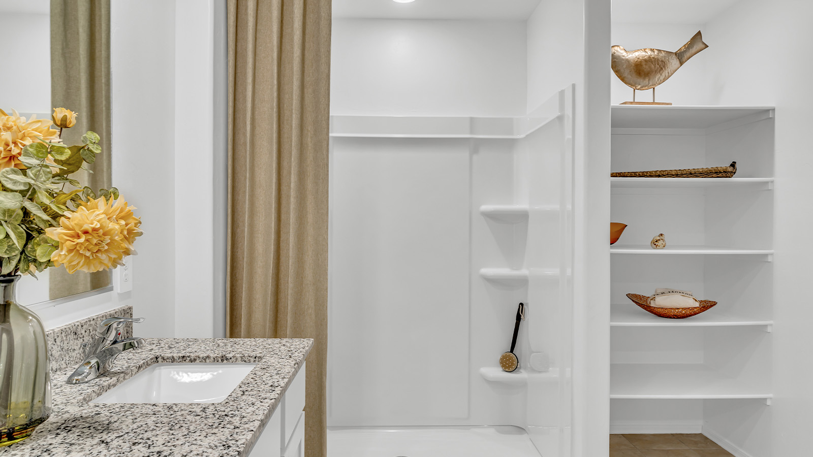 Welcome to the Gaven plan, a spacious single-story new home within Saguaro Bloom, where modern living meets the serene beauty of the Arizona landscape. This thoughtfully crafted residence offers 1,815 square feet of well-designed living space, featuring four bedrooms and two full bathrooms, perfect for families who value both comfort and style. As you step through the front door, you’ll be greeted by a bright and airy entryway that seamlessly transitions into the heart of the home. The open layout connects the great room, dining area, and kitchen, creating an ideal environment for both everyday living and entertaining. The kitchen is a culinary haven, equipped with state-of-the-art appliances, a spacious pantry, and elegant quartz countertops that extend to a large island, perfect for meal prep or casual dining.  The master suite, nestled at the rear of the home, offers a peaceful retreat with a generously sized walk-in closet and a luxurious en-suite bathroom. The additional three bedrooms are strategically placed to provide privacy and convenience, making them perfect for children, guests, or even a home office. Outside, the covered patio extends your living space into the beautifully landscaped backyard, ideal for enjoying Arizona’s stunning sunsets. The front yard is also fully landscaped and equipped with an auto drip irrigation system, ensuring your home’s curb appeal is maintained with ease.  Each home within Saguaro Bloom, including the Gaven plan, is outfitted with D.R. Horton’s Home is Connected® Smart Home package, featuring a smart thermostat, video doorbell, keyless entry, and Wi-Fi-enabled garage door opener. Energy efficiency is a cornerstone of the design, with features like spray foam insulation, tankless water heaters, and LED lighting, all contributing to long-term savings and environmental sustainability.  Saguaro Bloom isn’t just a place to live; it’s a vibrant community with a wealth of amenities, from scenic walking trails to pools and playgrounds, ensuring that there’s always something for everyone. Embrace the lifestyle you’ve always dreamed of in the Gaven plan—a perfect blend of comfort, convenience, and Arizona charm