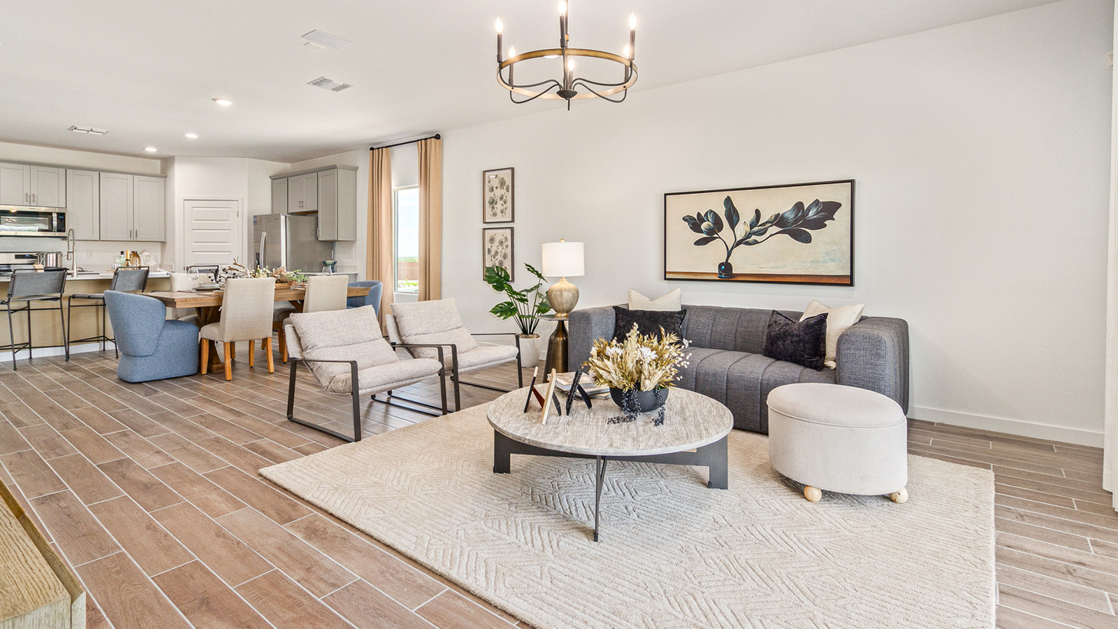 Welcome to The Gaven plan, a spacious single-story within Saguaro Bloom, where modern living meets the serene beauty of the Arizona landscape. This thoughtfully crafted layout offers 1,815 square feet of well-designed living space, featuring four bedrooms and two full bathrooms, perfect for families who value both comfort and style.  As you enter the home, you’ll be greeted by a bright and airy entryway that seamlessly transitions into the heart of the home. The open layout connects the great room, dining area, and kitchen area. The kitchen is a culinary haven, equipped with state-of-the-art appliances, a spacious pantry, and elegant quartz countertops that extend to a large island, perfect for meal prep or casual dining.  The primary suite, nestled at the rear of the home, offers a peaceful retreat with a generously sized walk-in closet and a luxurious en-suite bathroom. The additional three bedrooms are strategically placed to provide privacy and convenience, making them perfect for children, guests, or even a home office. Outside, the covered patio extends your living space, ideal for enjoying Arizona’s stunning sunsets. The front yard is fully landscaped and equipped with an auto drip irrigation system, ensuring your home’s curb appeal is maintained with ease.  Each home within Saguaro Bloom, is outfitted with D.R. Horton’s Home is Connected® Smart Home package, featuring a smart thermostat, video doorbell, keyless entry, and Wi-Fi-enabled garage door opener. Energy efficiency is a cornerstone of the design, with features like spray foam insulation, tankless water heater, and LED lighting, all contributing to long-term savings and environmental sustainability.  Saguaro Bloom is a vibrant community with a wealth of amenities, from scenic walking trails to pools and playgrounds, ensuring that there’s always something for everyone. Embrace the lifestyle you’ve always dreamed of in The Gaven — a perfect blend of comfort, convenience, and Arizona charm.  *Images shown are for reference only. They depict the sales model home and may not represent the actual home.