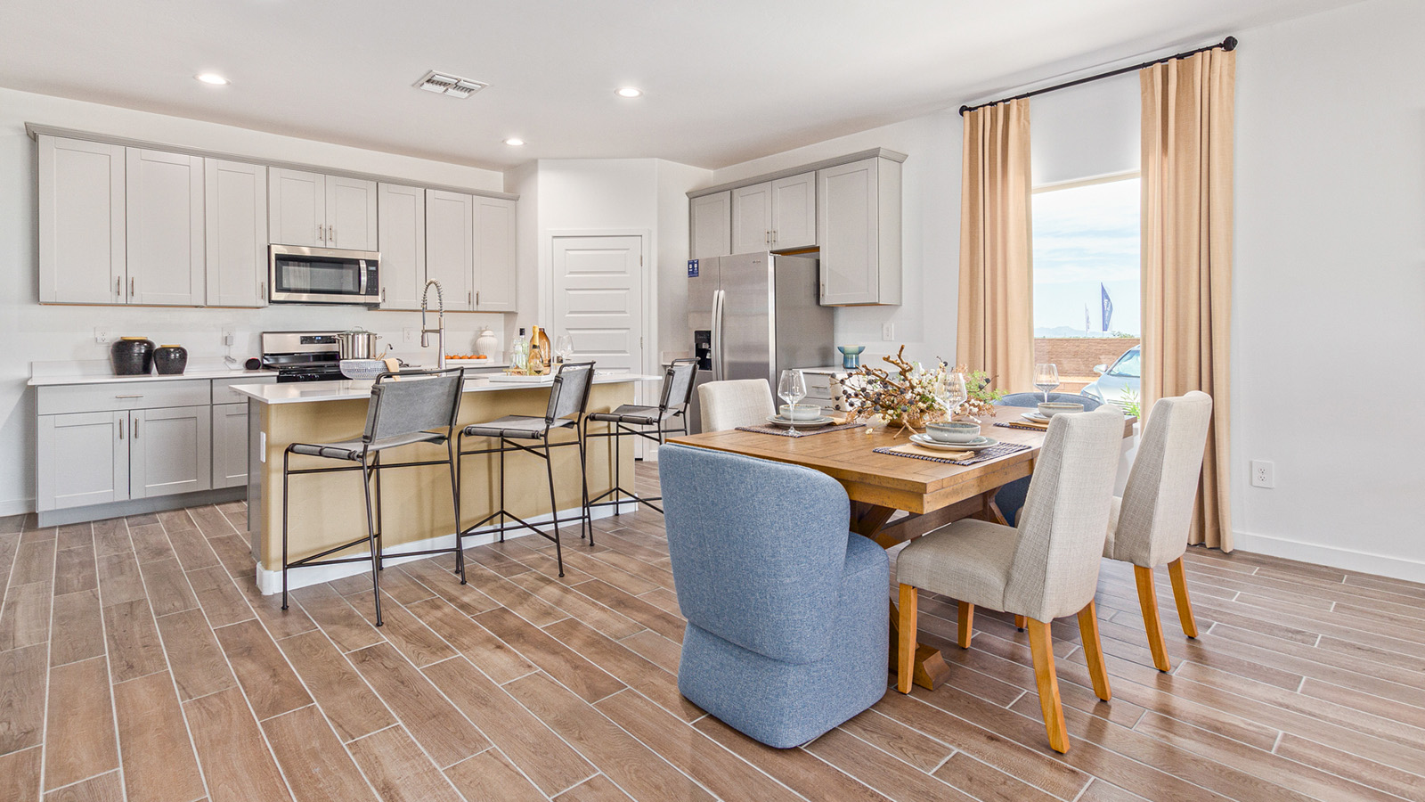 Welcome to The Gaven plan, a spacious single-story within Saguaro Bloom, where modern living meets the serene beauty of the Arizona landscape. This thoughtfully crafted layout offers 1,815 square feet of well-designed living space, featuring four bedrooms and two full bathrooms, perfect for families who value both comfort and style.  As you enter the home, you’ll be greeted by a bright and airy entryway that seamlessly transitions into the heart of the home. The open layout connects the great room, dining area, and kitchen area. The kitchen is a culinary haven, equipped with state-of-the-art appliances, a spacious pantry, and elegant quartz countertops that extend to a large island, perfect for meal prep or casual dining.  The primary suite, nestled at the rear of the home, offers a peaceful retreat with a generously sized walk-in closet and a luxurious en-suite bathroom. The additional three bedrooms are strategically placed to provide privacy and convenience, making them perfect for children, guests, or even a home office. Outside, the covered patio extends your living space, ideal for enjoying Arizona’s stunning sunsets. The front yard is fully landscaped and equipped with an auto drip irrigation system, ensuring your home’s curb appeal is maintained with ease.  Each home within Saguaro Bloom, is outfitted with D.R. Horton’s Home is Connected® Smart Home package, featuring a smart thermostat, video doorbell, keyless entry, and Wi-Fi-enabled garage door opener. Energy efficiency is a cornerstone of the design, with features like spray foam insulation, tankless water heater, and LED lighting, all contributing to long-term savings and environmental sustainability.  Saguaro Bloom is a vibrant community with a wealth of amenities, from scenic walking trails to pools and playgrounds, ensuring that there’s always something for everyone. Embrace the lifestyle you’ve always dreamed of in The Gaven — a perfect blend of comfort, convenience, and Arizona charm.  *Images shown are for reference only. They depict the Gaven model home and may not represent the actual home.