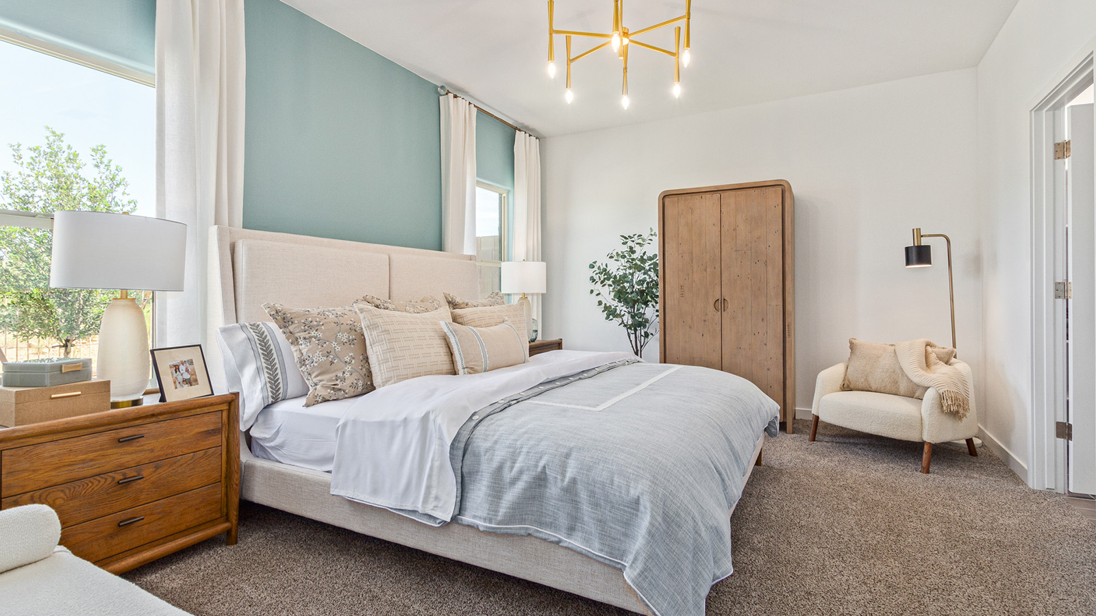 Welcome to The Gaven plan, a spacious single-story within Saguaro Bloom, where modern living meets the serene beauty of the Arizona landscape. This thoughtfully crafted layout offers 1,815 square feet of well-designed living space, featuring four bedrooms and two full bathrooms, perfect for families who value both comfort and style.  As you enter the home, you’ll be greeted by a bright and airy entryway that seamlessly transitions into the heart of the home. The open layout connects the great room, dining area, and kitchen area. The kitchen is a culinary haven, equipped with state-of-the-art appliances, a spacious pantry, and elegant quartz countertops that extend to a large island, perfect for meal prep or casual dining.  The primary suite, nestled at the rear of the home, offers a peaceful retreat with a generously sized walk-in closet and a luxurious en-suite bathroom. The additional three bedrooms are strategically placed to provide privacy and convenience, making them perfect for children, guests, or even a home office. Outside, the covered patio extends your living space, ideal for enjoying Arizona’s stunning sunsets. The front yard is fully landscaped and equipped with an auto drip irrigation system, ensuring your home’s curb appeal is maintained with ease.  Each home within Saguaro Bloom, is outfitted with D.R. Horton’s Home is Connected® Smart Home package, featuring a smart thermostat, video doorbell, keyless entry, and Wi-Fi-enabled garage door opener. Energy efficiency is a cornerstone of the design, with features like spray foam insulation, tankless water heater, and LED lighting, all contributing to long-term savings and environmental sustainability.  Saguaro Bloom is a vibrant community with a wealth of amenities, from scenic walking trails to pools and playgrounds, ensuring that there’s always something for everyone. Embrace the lifestyle you’ve always dreamed of in The Gaven — a perfect blend of comfort, convenience, and Arizona charm.  *Images shown are for reference only. They depict the Gaven model home and may not represent the actual home.