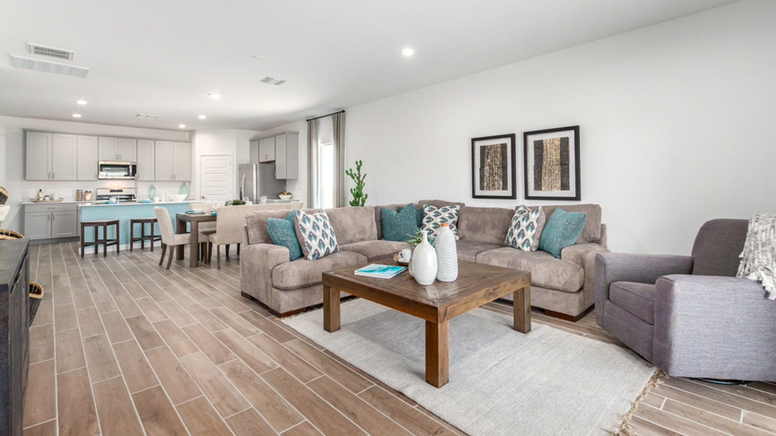 Welcome to The Gaven plan, a spacious single-story within Saguaro Bloom, where modern living meets the serene beauty of the Arizona landscape. This thoughtfully crafted layout offers 1,815 square feet of well-designed living space, featuring four bedrooms and two full bathrooms, perfect for families who value both comfort and style.  As you enter the home, you’ll be greeted by a bright and airy entryway that seamlessly transitions into the heart of the home. The open layout connects the great room, dining area, and kitchen area. The kitchen is a culinary haven, equipped with state-of-the-art appliances, a spacious pantry, and elegant quartz countertops that extend to a large island, perfect for meal prep or casual dining.  The primary suite, nestled at the rear of the home, offers a peaceful retreat with a generously sized walk-in closet and a luxurious en-suite bathroom. The additional three bedrooms are strategically placed to provide privacy and convenience, making them perfect for children, guests, or even a home office. Outside, the covered patio extends your living space, ideal for enjoying Arizona’s stunning sunsets. The front yard is fully landscaped and equipped with an auto drip irrigation system, ensuring your home’s curb appeal is maintained with ease.  Each home within Saguaro Bloom, is outfitted with D.R. Horton’s Home is Connected® Smart Home package, featuring a smart thermostat, video doorbell, keyless entry, and Wi-Fi-enabled garage door opener. Energy efficiency is a cornerstone of the design, with features like spray foam insulation, tankless water heater, and LED lighting, all contributing to long-term savings and environmental sustainability.  Saguaro Bloom is a vibrant community with a wealth of amenities, from scenic walking trails to pools and playgrounds, ensuring that there’s always something for everyone. Embrace the lifestyle you’ve always dreamed of in The Gaven — a perfect blend of comfort, convenience, and Arizona charm.  *Images shown are for reference only. They depict the Gaven Model home and may not represent the actual home.