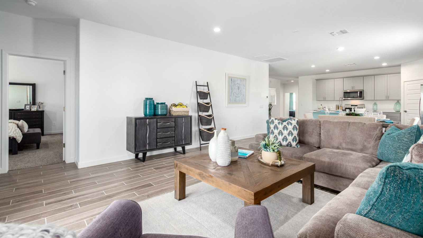 Welcome to The Gaven plan, a spacious single-story within Saguaro Bloom, where modern living meets the serene beauty of the Arizona landscape. This thoughtfully crafted layout offers 1,815 square feet of well-designed living space, featuring four bedrooms and two full bathrooms, perfect for families who value both comfort and style.  As you enter the home, you’ll be greeted by a bright and airy entryway that seamlessly transitions into the heart of the home. The open layout connects the great room, dining area, and kitchen area. The kitchen is a culinary haven, equipped with state-of-the-art appliances, a spacious pantry, and elegant quartz countertops that extend to a large island, perfect for meal prep or casual dining.  The primary suite, nestled at the rear of the home, offers a peaceful retreat with a generously sized walk-in closet and a luxurious en-suite bathroom. The additional three bedrooms are strategically placed to provide privacy and convenience, making them perfect for children, guests, or even a home office. Outside, the covered patio extends your living space, ideal for enjoying Arizona’s stunning sunsets. The front yard is fully landscaped and equipped with an auto drip irrigation system, ensuring your home’s curb appeal is maintained with ease.  Each home within Saguaro Bloom, is outfitted with D.R. Horton’s Home is Connected® Smart Home package, featuring a smart thermostat, video doorbell, keyless entry, and Wi-Fi-enabled garage door opener. Energy efficiency is a cornerstone of the design, with features like spray foam insulation, tankless water heater, and LED lighting, all contributing to long-term savings and environmental sustainability.  Saguaro Bloom is a vibrant community with a wealth of amenities, from scenic walking trails to pools and playgrounds, ensuring that there’s always something for everyone. Embrace the lifestyle you’ve always dreamed of in The Gaven — a perfect blend of comfort, convenience, and Arizona charm.  *Images shown are for reference only. They depict the Gaven Model home and may not represent the actual home.