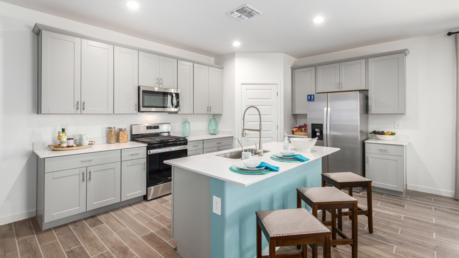 Welcome to The Gaven plan, a spacious single-story within Saguaro Bloom, where modern living meets the serene beauty of the Arizona landscape. This thoughtfully crafted layout offers 1,815 square feet of well-designed living space, featuring four bedrooms and two full bathrooms, perfect for families who value both comfort and style.  As you enter the home, you’ll be greeted by a bright and airy entryway that seamlessly transitions into the heart of the home. The open layout connects the great room, dining area, and kitchen area. The kitchen is a culinary haven, equipped with state-of-the-art appliances, a spacious pantry, and elegant quartz countertops that extend to a large island, perfect for meal prep or casual dining.  The primary suite, nestled at the rear of the home, offers a peaceful retreat with a generously sized walk-in closet and a luxurious en-suite bathroom. The additional three bedrooms are strategically placed to provide privacy and convenience, making them perfect for children, guests, or even a home office. Outside, the covered patio extends your living space, ideal for enjoying Arizona’s stunning sunsets. The front yard is fully landscaped and equipped with an auto drip irrigation system, ensuring your home’s curb appeal is maintained with ease.  Each home within Saguaro Bloom, is outfitted with D.R. Horton’s Home is Connected® Smart Home package, featuring a smart thermostat, video doorbell, keyless entry, and Wi-Fi-enabled garage door opener. Energy efficiency is a cornerstone of the design, with features like spray foam insulation, tankless water heater, and LED lighting, all contributing to long-term savings and environmental sustainability.  Saguaro Bloom is a vibrant community with a wealth of amenities, from scenic walking trails to pools and playgrounds, ensuring that there’s always something for everyone. Embrace the lifestyle you’ve always dreamed of in The Gaven — a perfect blend of comfort, convenience, and Arizona charm.  *Images shown are for reference only. They depict the Gaven Model home and may not represent the actual home.