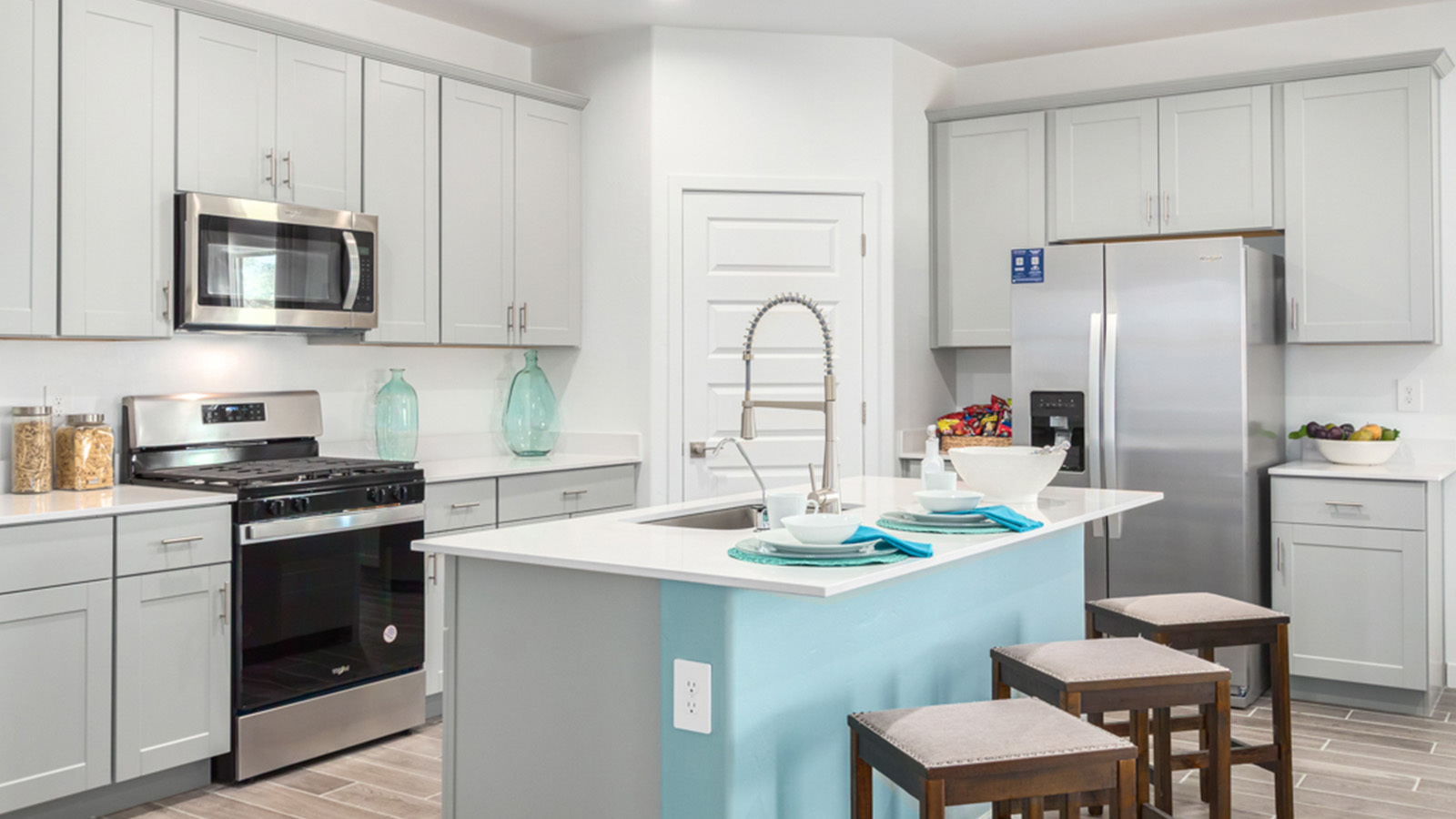 Welcome to The Gaven plan, a spacious single-story within Saguaro Bloom, where modern living meets the serene beauty of the Arizona landscape. This thoughtfully crafted layout offers 1,815 square feet of well-designed living space, featuring four bedrooms and two full bathrooms, perfect for families who value both comfort and style.  As you enter the home, you’ll be greeted by a bright and airy entryway that seamlessly transitions into the heart of the home. The open layout connects the great room, dining area, and kitchen area. The kitchen is a culinary haven, equipped with state-of-the-art appliances, a spacious pantry, and elegant quartz countertops that extend to a large island, perfect for meal prep or casual dining.  The primary suite, nestled at the rear of the home, offers a peaceful retreat with a generously sized walk-in closet and a luxurious en-suite bathroom. The additional three bedrooms are strategically placed to provide privacy and convenience, making them perfect for children, guests, or even a home office. Outside, the covered patio extends your living space, ideal for enjoying Arizona’s stunning sunsets. The front yard is fully landscaped and equipped with an auto drip irrigation system, ensuring your home’s curb appeal is maintained with ease.  Each home within Saguaro Bloom, is outfitted with D.R. Horton’s Home is Connected® Smart Home package, featuring a smart thermostat, video doorbell, keyless entry, and Wi-Fi-enabled garage door opener. Energy efficiency is a cornerstone of the design, with features like spray foam insulation, tankless water heater, and LED lighting, all contributing to long-term savings and environmental sustainability.  Saguaro Bloom is a vibrant community with a wealth of amenities, from scenic walking trails to pools and playgrounds, ensuring that there’s always something for everyone. Embrace the lifestyle you’ve always dreamed of in The Gaven — a perfect blend of comfort, convenience, and Arizona charm.  *Images shown are for reference only. They depict the Gaven Model home and may not represent the actual home.