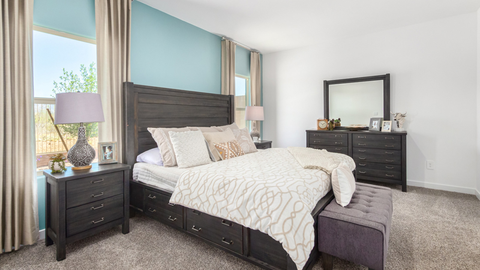 Welcome to The Gaven plan, a spacious single-story within Saguaro Bloom, where modern living meets the serene beauty of the Arizona landscape. This thoughtfully crafted layout offers 1,815 square feet of well-designed living space, featuring four bedrooms and two full bathrooms, perfect for families who value both comfort and style.  As you enter the home, you’ll be greeted by a bright and airy entryway that seamlessly transitions into the heart of the home. The open layout connects the great room, dining area, and kitchen area. The kitchen is a culinary haven, equipped with state-of-the-art appliances, a spacious pantry, and elegant quartz countertops that extend to a large island, perfect for meal prep or casual dining.  The primary suite, nestled at the rear of the home, offers a peaceful retreat with a generously sized walk-in closet and a luxurious en-suite bathroom. The additional three bedrooms are strategically placed to provide privacy and convenience, making them perfect for children, guests, or even a home office. Outside, the covered patio extends your living space, ideal for enjoying Arizona’s stunning sunsets. The front yard is fully landscaped and equipped with an auto drip irrigation system, ensuring your home’s curb appeal is maintained with ease.  Each home within Saguaro Bloom, is outfitted with D.R. Horton’s Home is Connected® Smart Home package, featuring a smart thermostat, video doorbell, keyless entry, and Wi-Fi-enabled garage door opener. Energy efficiency is a cornerstone of the design, with features like spray foam insulation, tankless water heater, and LED lighting, all contributing to long-term savings and environmental sustainability.  Saguaro Bloom is a vibrant community with a wealth of amenities, from scenic walking trails to pools and playgrounds, ensuring that there’s always something for everyone. Embrace the lifestyle you’ve always dreamed of in The Gaven — a perfect blend of comfort, convenience, and Arizona charm.  *Images shown are for reference only. They depict the Gaven Model home and may not represent the actual home.