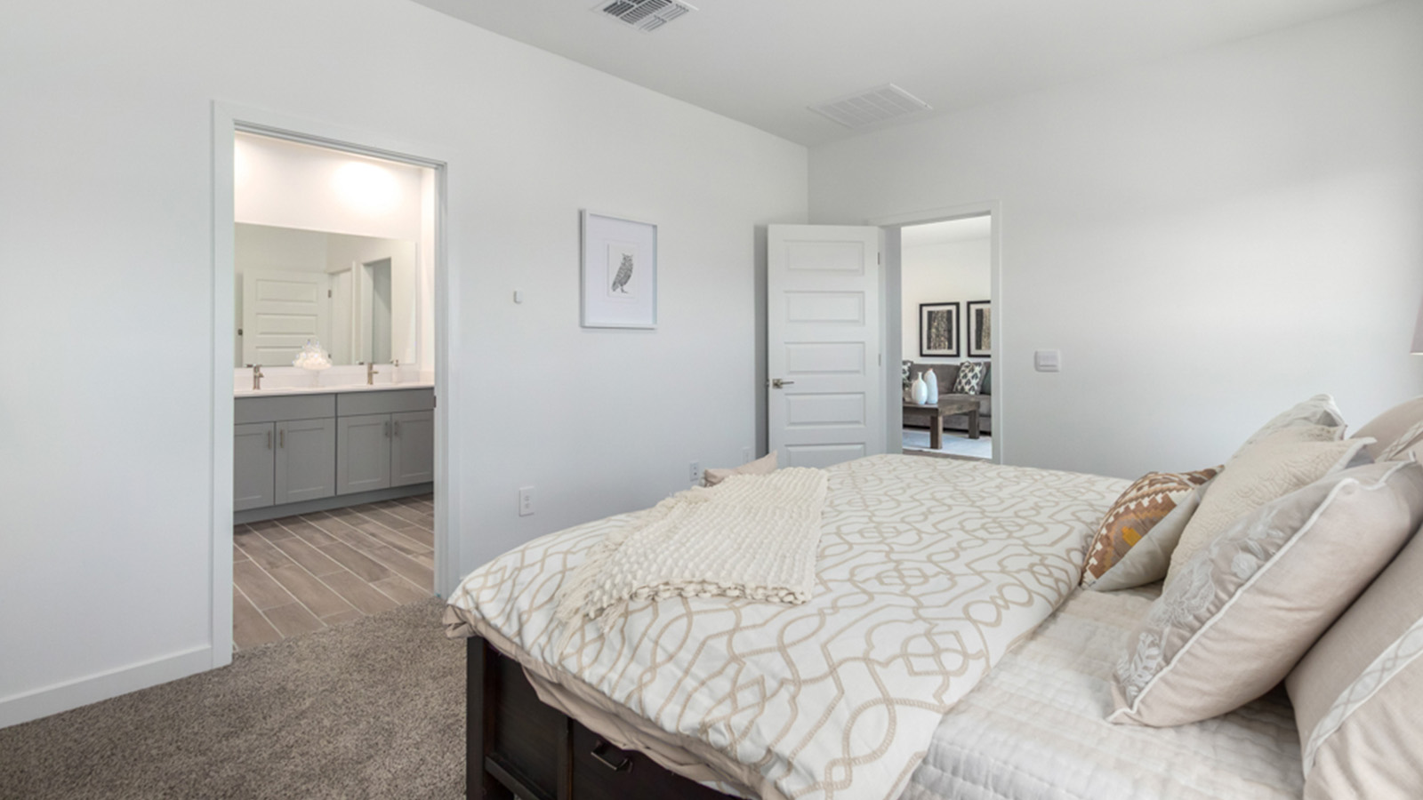 Welcome to The Gaven plan, a spacious single-story within Saguaro Bloom, where modern living meets the serene beauty of the Arizona landscape. This thoughtfully crafted layout offers 1,815 square feet of well-designed living space, featuring four bedrooms and two full bathrooms, perfect for families who value both comfort and style.  As you enter the home, you’ll be greeted by a bright and airy entryway that seamlessly transitions into the heart of the home. The open layout connects the great room, dining area, and kitchen area. The kitchen is a culinary haven, equipped with state-of-the-art appliances, a spacious pantry, and elegant quartz countertops that extend to a large island, perfect for meal prep or casual dining.  The primary suite, nestled at the rear of the home, offers a peaceful retreat with a generously sized walk-in closet and a luxurious en-suite bathroom. The additional three bedrooms are strategically placed to provide privacy and convenience, making them perfect for children, guests, or even a home office. Outside, the covered patio extends your living space, ideal for enjoying Arizona’s stunning sunsets. The front yard is fully landscaped and equipped with an auto drip irrigation system, ensuring your home’s curb appeal is maintained with ease.  Each home within Saguaro Bloom, is outfitted with D.R. Horton’s Home is Connected® Smart Home package, featuring a smart thermostat, video doorbell, keyless entry, and Wi-Fi-enabled garage door opener. Energy efficiency is a cornerstone of the design, with features like spray foam insulation, tankless water heater, and LED lighting, all contributing to long-term savings and environmental sustainability.  Saguaro Bloom is a vibrant community with a wealth of amenities, from scenic walking trails to pools and playgrounds, ensuring that there’s always something for everyone. Embrace the lifestyle you’ve always dreamed of in The Gaven — a perfect blend of comfort, convenience, and Arizona charm.  *Images shown are for reference only. They depict the Gaven Model home and may not represent the actual home.