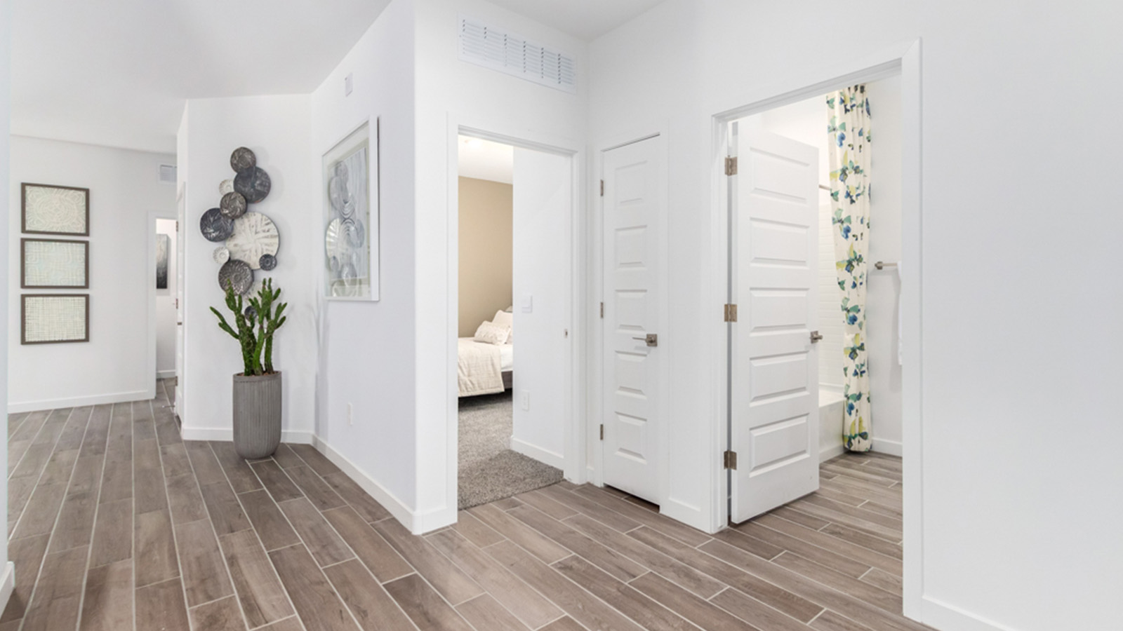 Welcome to The Gaven plan, a spacious single-story within Saguaro Bloom, where modern living meets the serene beauty of the Arizona landscape. This thoughtfully crafted layout offers 1,815 square feet of well-designed living space, featuring four bedrooms and two full bathrooms, perfect for families who value both comfort and style.  As you enter the home, you’ll be greeted by a bright and airy entryway that seamlessly transitions into the heart of the home. The open layout connects the great room, dining area, and kitchen area. The kitchen is a culinary haven, equipped with state-of-the-art appliances, a spacious pantry, and elegant quartz countertops that extend to a large island, perfect for meal prep or casual dining.  The primary suite, nestled at the rear of the home, offers a peaceful retreat with a generously sized walk-in closet and a luxurious en-suite bathroom. The additional three bedrooms are strategically placed to provide privacy and convenience, making them perfect for children, guests, or even a home office. Outside, the covered patio extends your living space, ideal for enjoying Arizona’s stunning sunsets. The front yard is fully landscaped and equipped with an auto drip irrigation system, ensuring your home’s curb appeal is maintained with ease.  Each home within Saguaro Bloom, is outfitted with D.R. Horton’s Home is Connected® Smart Home package, featuring a smart thermostat, video doorbell, keyless entry, and Wi-Fi-enabled garage door opener. Energy efficiency is a cornerstone of the design, with features like spray foam insulation, tankless water heater, and LED lighting, all contributing to long-term savings and environmental sustainability.  Saguaro Bloom is a vibrant community with a wealth of amenities, from scenic walking trails to pools and playgrounds, ensuring that there’s always something for everyone. Embrace the lifestyle you’ve always dreamed of in The Gaven — a perfect blend of comfort, convenience, and Arizona charm.  *Images shown are for reference only. They depict the Gaven Model home and may not represent the actual home.