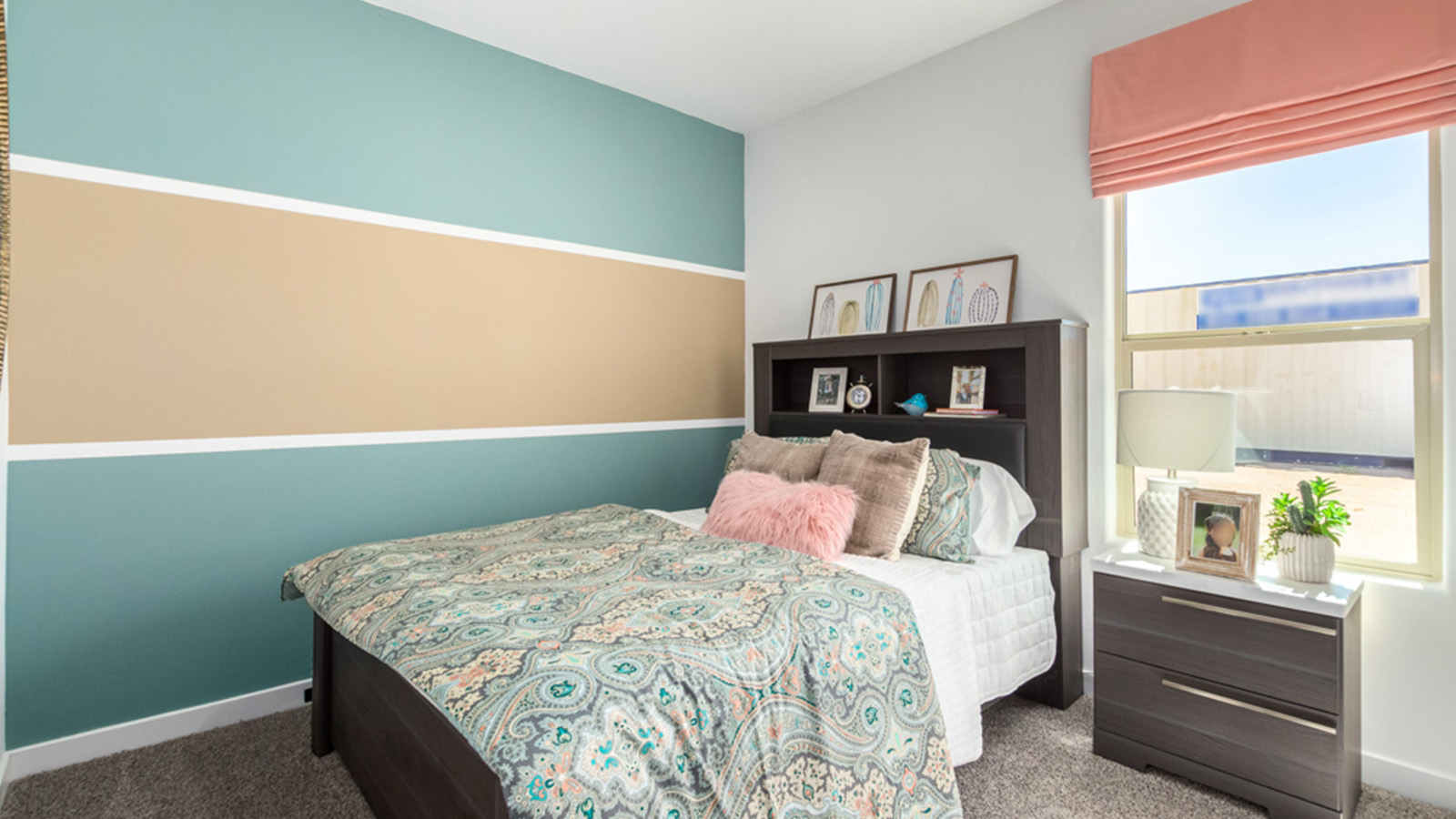 Welcome to The Gaven plan, a spacious single-story within Saguaro Bloom, where modern living meets the serene beauty of the Arizona landscape. This thoughtfully crafted layout offers 1,815 square feet of well-designed living space, featuring four bedrooms and two full bathrooms, perfect for families who value both comfort and style.  As you enter the home, you’ll be greeted by a bright and airy entryway that seamlessly transitions into the heart of the home. The open layout connects the great room, dining area, and kitchen area. The kitchen is a culinary haven, equipped with state-of-the-art appliances, a spacious pantry, and elegant quartz countertops that extend to a large island, perfect for meal prep or casual dining.  The primary suite, nestled at the rear of the home, offers a peaceful retreat with a generously sized walk-in closet and a luxurious en-suite bathroom. The additional three bedrooms are strategically placed to provide privacy and convenience, making them perfect for children, guests, or even a home office. Outside, the covered patio extends your living space, ideal for enjoying Arizona’s stunning sunsets. The front yard is fully landscaped and equipped with an auto drip irrigation system, ensuring your home’s curb appeal is maintained with ease.  Each home within Saguaro Bloom, is outfitted with D.R. Horton’s Home is Connected® Smart Home package, featuring a smart thermostat, video doorbell, keyless entry, and Wi-Fi-enabled garage door opener. Energy efficiency is a cornerstone of the design, with features like spray foam insulation, tankless water heater, and LED lighting, all contributing to long-term savings and environmental sustainability.  Saguaro Bloom is a vibrant community with a wealth of amenities, from scenic walking trails to pools and playgrounds, ensuring that there’s always something for everyone. Embrace the lifestyle you’ve always dreamed of in The Gaven — a perfect blend of comfort, convenience, and Arizona charm.  *Images shown are for reference only. They depict the Gaven Model home and may not represent the actual home.