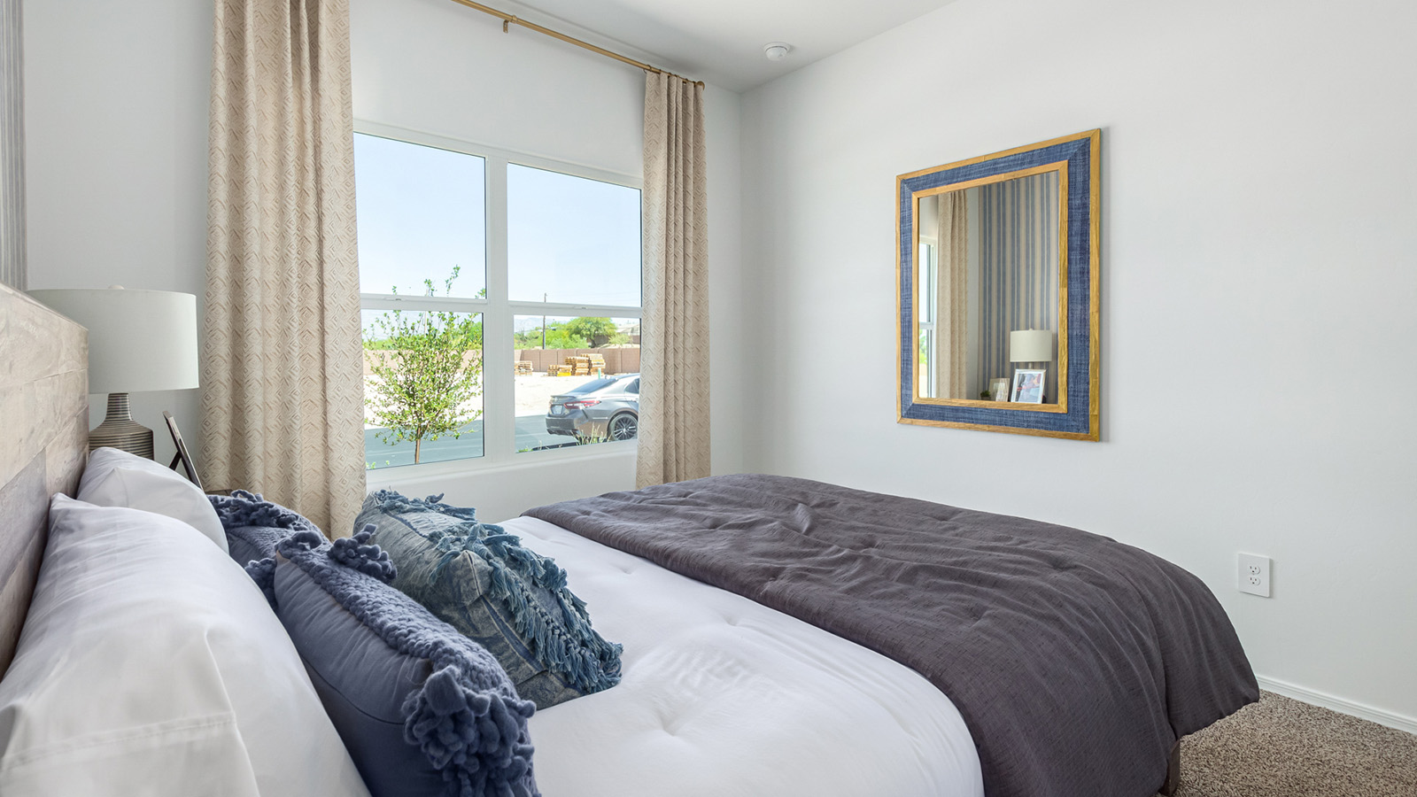 Welcome to The Gaven plan, a spacious single-story within Saguaro Bloom, where modern living meets the serene beauty of the Arizona landscape. This thoughtfully crafted layout offers 1,815 square feet of well-designed living space, featuring four bedrooms and two full bathrooms, perfect for families who value both comfort and style.  As you enter the home, you’ll be greeted by a bright and airy entryway that seamlessly transitions into the heart of the home. The open layout connects the great room, dining area, and kitchen area. The kitchen is a culinary haven, equipped with state-of-the-art appliances, a spacious pantry, and elegant quartz countertops that extend to a large island, perfect for meal prep or casual dining.  The primary suite, nestled at the rear of the home, offers a peaceful retreat with a generously sized walk-in closet and a luxurious en-suite bathroom. The additional three bedrooms are strategically placed to provide privacy and convenience, making them perfect for children, guests, or even a home office. Outside, the covered patio extends your living space, ideal for enjoying Arizona’s stunning sunsets. The front yard is fully landscaped and equipped with an auto drip irrigation system, ensuring your home’s curb appeal is maintained with ease.  Each home within Saguaro Bloom, is outfitted with D.R. Horton’s Home is Connected® Smart Home package, featuring a smart thermostat, video doorbell, keyless entry, and Wi-Fi-enabled garage door opener. Energy efficiency is a cornerstone of the design, with features like spray foam insulation, tankless water heater, and LED lighting, all contributing to long-term savings and environmental sustainability.  Saguaro Bloom is a vibrant community with a wealth of amenities, from scenic walking trails to pools and playgrounds, ensuring that there’s always something for everyone. Embrace the lifestyle you’ve always dreamed of in The Gaven — a perfect blend of comfort, convenience, and Arizona charm.  *Images shown are for reference only. They depict the Gaven model home and may not represent the actual home.