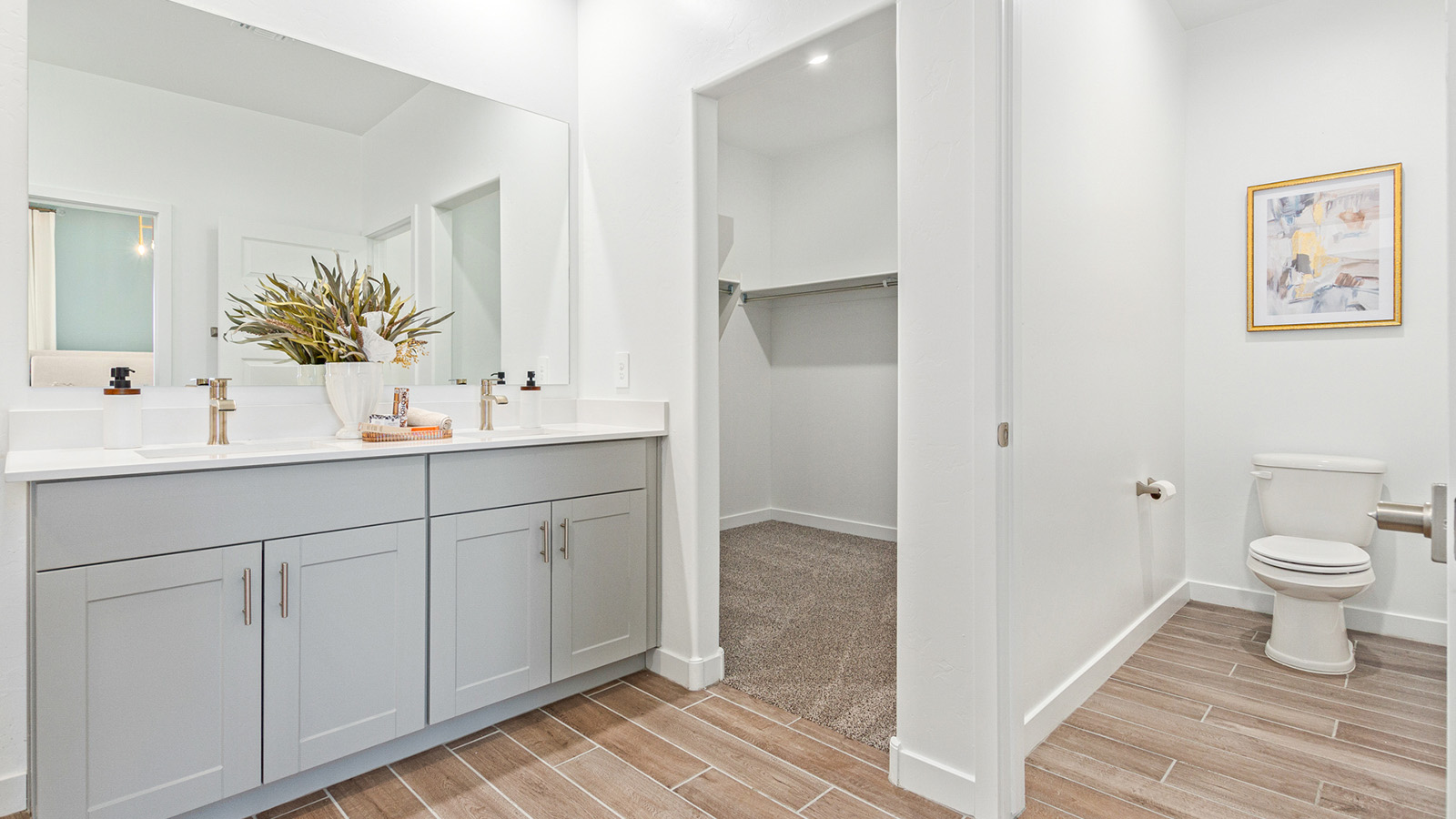 Welcome to the Gaven plan, a spacious single-story new home within Saguaro Bloom, where modern living meets the serene beauty of the Arizona landscape. This thoughtfully crafted residence offers 1,815 square feet of well-designed living space, featuring four bedrooms and two full bathrooms, perfect for families who value both comfort and style. As you step through the front door, you’ll be greeted by a bright and airy entryway that seamlessly transitions into the heart of the home. The open layout connects the great room, dining area, and kitchen, creating an ideal environment for both everyday living and entertaining. The kitchen is a culinary haven, equipped with state-of-the-art appliances, a spacious pantry, and elegant quartz countertops that extend to a large island, perfect for meal prep or casual dining.  The master suite, nestled at the rear of the home, offers a peaceful retreat with a generously sized walk-in closet and a luxurious en-suite bathroom. The additional three bedrooms are strategically placed to provide privacy and convenience, making them perfect for children, guests, or even a home office. Outside, the covered patio extends your living space into the beautifully landscaped backyard, ideal for enjoying Arizona’s stunning sunsets. The front yard is also fully landscaped and equipped with an auto drip irrigation system, ensuring your home’s curb appeal is maintained with ease.  Each home within Saguaro Bloom, including the Gaven plan, is outfitted with D.R. Horton’s Home is Connected® Smart Home package, featuring a smart thermostat, video doorbell, keyless entry, and Wi-Fi-enabled garage door opener. Energy efficiency is a cornerstone of the design, with features like spray foam insulation, tankless water heaters, and LED lighting, all contributing to long-term savings and environmental sustainability.  Saguaro Bloom isn’t just a place to live; it’s a vibrant community with a wealth of amenities, from scenic walking trails to pools and playgrounds, ensuring that there’s always something for everyone. Embrace the lifestyle you’ve always dreamed of in the Gaven plan—a perfect blend of comfort, convenience, and Arizona charm