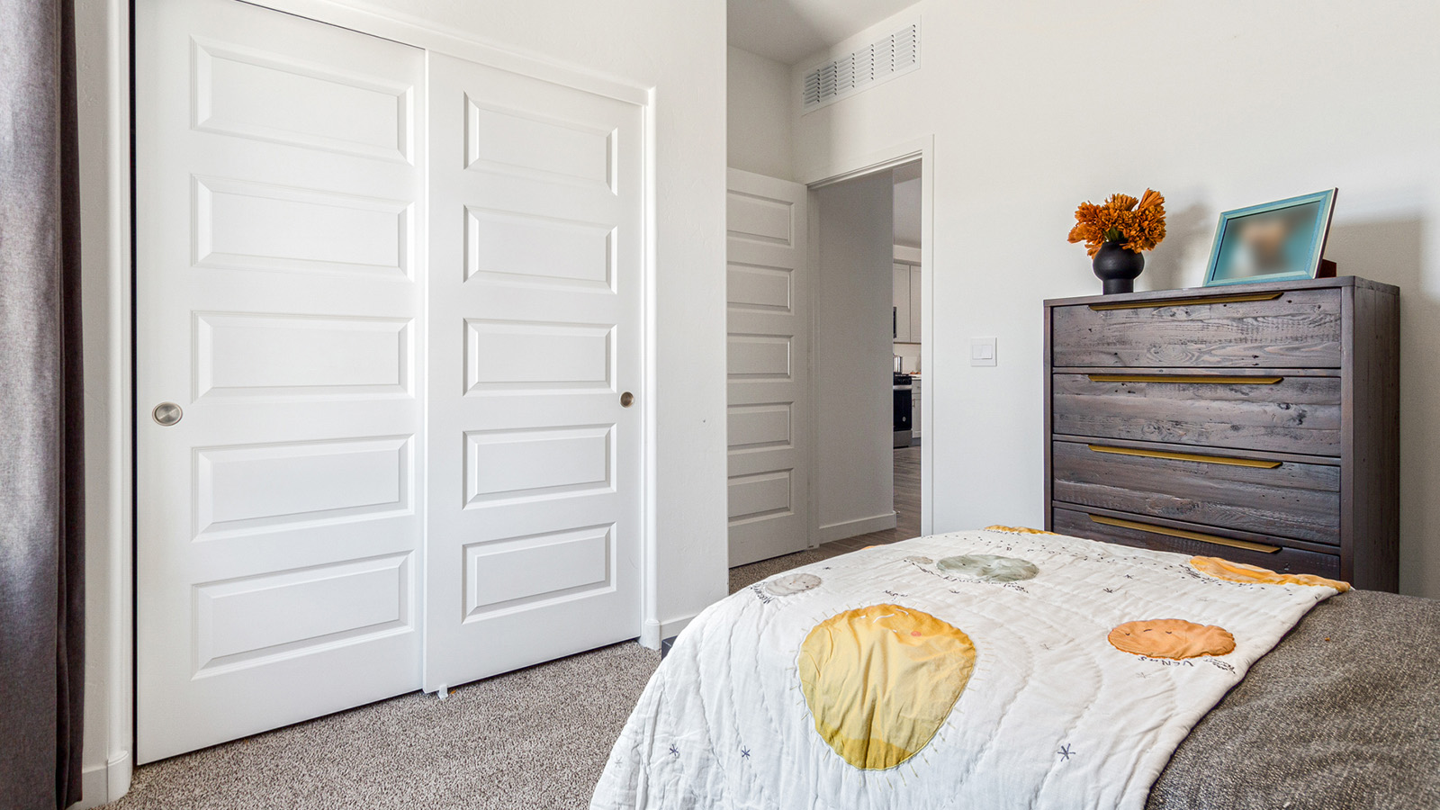 Welcome to the Gaven plan, a spacious single-story new home within Saguaro Bloom, where modern living meets the serene beauty of the Arizona landscape. This thoughtfully crafted residence offers 1,815 square feet of well-designed living space, featuring four bedrooms and two full bathrooms, perfect for families who value both comfort and style. As you step through the front door, you’ll be greeted by a bright and airy entryway that seamlessly transitions into the heart of the home. The open layout connects the great room, dining area, and kitchen, creating an ideal environment for both everyday living and entertaining. The kitchen is a culinary haven, equipped with state-of-the-art appliances, a spacious pantry, and elegant quartz countertops that extend to a large island, perfect for meal prep or casual dining.  The master suite, nestled at the rear of the home, offers a peaceful retreat with a generously sized walk-in closet and a luxurious en-suite bathroom. The additional three bedrooms are strategically placed to provide privacy and convenience, making them perfect for children, guests, or even a home office. Outside, the covered patio extends your living space into the beautifully landscaped backyard, ideal for enjoying Arizona’s stunning sunsets. The front yard is also fully landscaped and equipped with an auto drip irrigation system, ensuring your home’s curb appeal is maintained with ease.  Each home within Saguaro Bloom, including the Gaven plan, is outfitted with D.R. Horton’s Home is Connected® Smart Home package, featuring a smart thermostat, video doorbell, keyless entry, and Wi-Fi-enabled garage door opener. Energy efficiency is a cornerstone of the design, with features like spray foam insulation, tankless water heaters, and LED lighting, all contributing to long-term savings and environmental sustainability.  Saguaro Bloom isn’t just a place to live; it’s a vibrant community with a wealth of amenities, from scenic walking trails to pools and playgrounds, ensuring that there’s always something for everyone. Embrace the lifestyle you’ve always dreamed of in the Gaven plan—a perfect blend of comfort, convenience, and Arizona charm