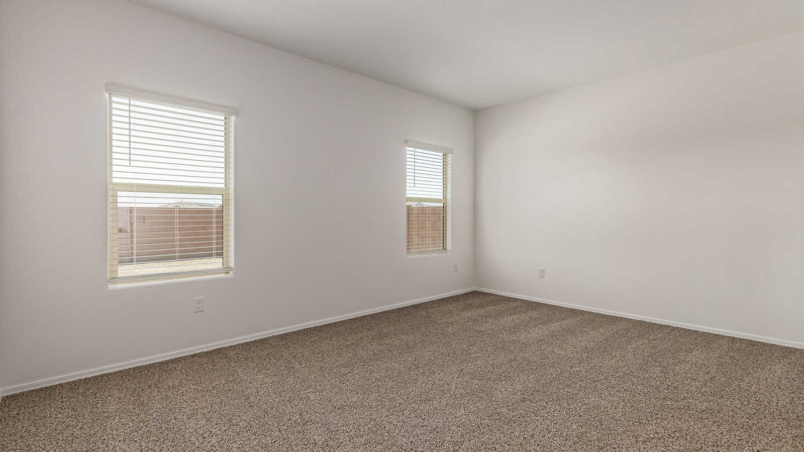 Discover The Easton at Saguaro Bloom in Marana, Arizona – a spacious 1,697 sq. ft. single-story new home designed to offer both style and functionality for today’s modern family.  As you enter through the front porch, you’re welcomed into a thoughtful layout that makes every square foot count. Near the front entrance is the first bedroom intentionally situated. This room can be utilized as a guest room, home office, or a cozy retreat.  Continuing down the hall you're welcomed into the great room, which flows seamlessly into the dining area and kitchen. This open-concept design ensures that the heart of the home is always connected. The kitchen is a culinary dream, featuring quartz countertops, a spacious island with a breakfast bar, and a walk-in pantry.  The great room opens up to a covered patio, an ideal space to unwind and enjoy beautiful desert sunsets. Whether you’re hosting a weekend barbecue or enjoying a quiet evening outdoors, this patio extends your living space into the scenic surroundings of Saguaro Bloom.  Just off the great room, a private hallway leads to the primary suite. The primary suite is generously sized and features a large walk-in closet, en-suite bathroom with walk-in shower, offering both privacy and convenience.  The Easton also features two additional bedrooms, well-positioned to share a full bathroom. These rooms are ideal for family members.  The Easton is designed with energy efficiency in mind and is DOE Zero Energy Ready Home Certified. This home includes a Connected® Smart Home package, featuring a smart thermostat, video doorbell, keyless entry, and Wi-Fi-enabled garage door opener. Energy efficiency is a cornerstone of the design, with features like spray foam insulation, and tankless water heater, offering long-term savings and sustainability.  Saguaro Bloom isn’t just a place to live, it’s a vibrant community with a wealth of amenities, from scenic walking trails to pools and playgrounds, ensuring that there’s always something for everyone.