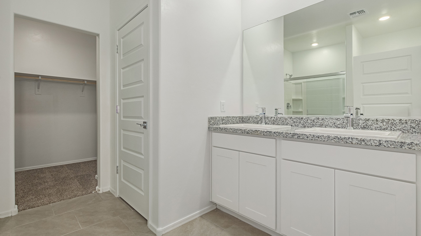 Discover The Easton at Saguaro Bloom in Marana, Arizona – a spacious 1,697 sq. ft. single-story new home designed to offer both style and functionality for today’s modern family.  As you enter through the front porch, you’re welcomed into a thoughtful layout that makes every square foot count. Near the front entrance is the first bedroom intentionally situated. This room can be utilized as a guest room, home office, or a cozy retreat.  Continuing down the hall you're welcomed into the great room, which flows seamlessly into the dining area and kitchen. This open-concept design ensures that the heart of the home is always connected. The kitchen is a culinary dream, featuring quartz countertops, a spacious island with a breakfast bar, and a walk-in pantry.  The great room opens up to a covered patio, an ideal space to unwind and enjoy beautiful desert sunsets. Whether you’re hosting a weekend barbecue or enjoying a quiet evening outdoors, this patio extends your living space into the scenic surroundings of Saguaro Bloom.  Just off the great room, a private hallway leads to the primary suite. The primary suite is generously sized and features a large walk-in closet, en-suite bathroom with walk-in shower, offering both privacy and convenience.  The Easton also features two additional bedrooms, well-positioned to share a full bathroom. These rooms are ideal for family members.  The Easton is designed with energy efficiency in mind and is DOE Zero Energy Ready Home Certified. This home includes a Connected® Smart Home package, featuring a smart thermostat, video doorbell, keyless entry, and Wi-Fi-enabled garage door opener. Energy efficiency is a cornerstone of the design, with features like spray foam insulation, and tankless water heater, offering long-term savings and sustainability.  Saguaro Bloom isn’t just a place to live, it’s a vibrant community with a wealth of amenities, from scenic walking trails to pools and playgrounds, ensuring that there’s always something for everyone.