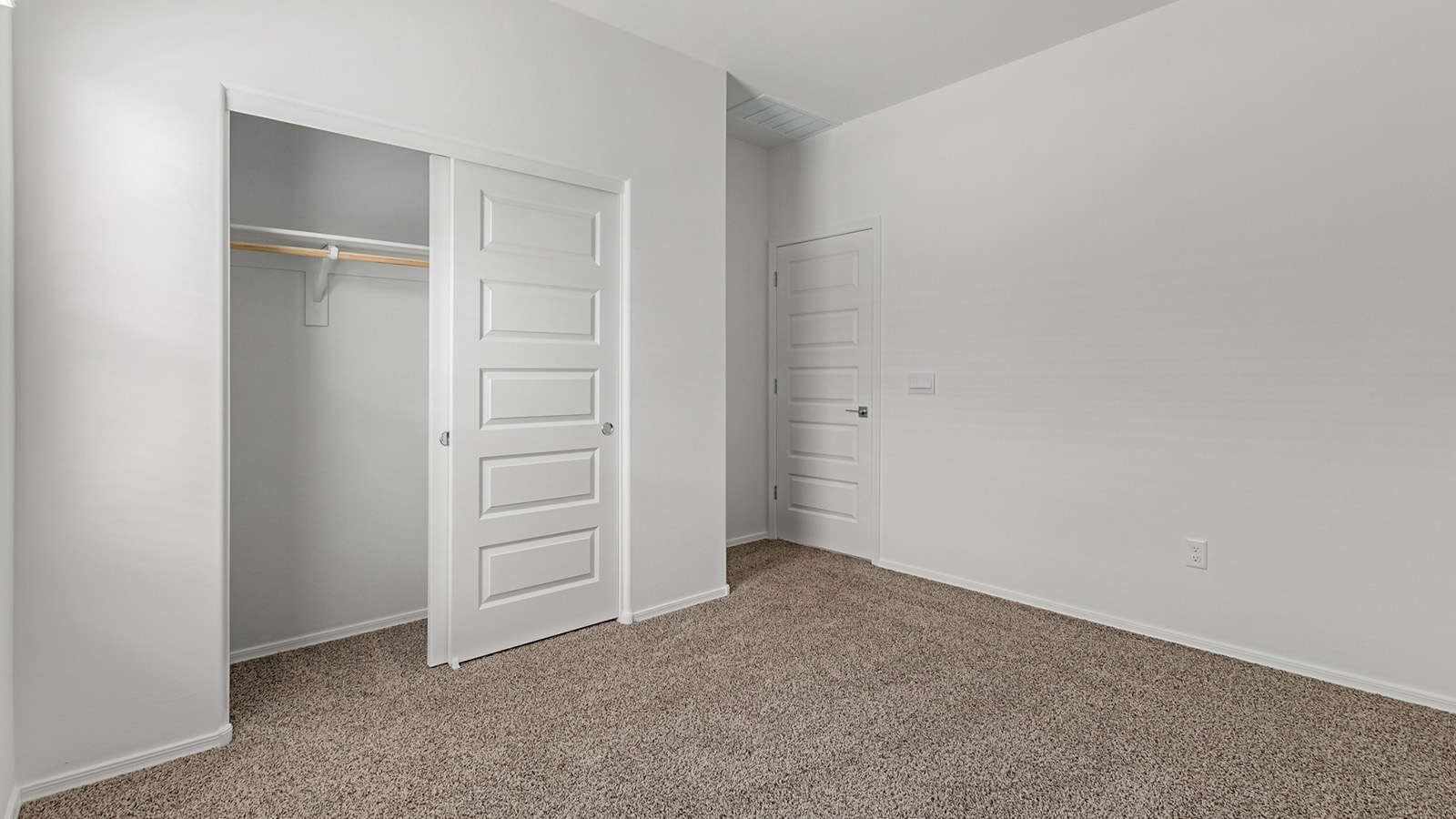 Discover The Easton at Saguaro Bloom in Marana, Arizona – a spacious 1,697 sq. ft. single-story new home designed to offer both style and functionality for today’s modern family.  As you enter through the front porch, you’re welcomed into a thoughtful layout that makes every square foot count. Near the front entrance is the first bedroom intentionally situated. This room can be utilized as a guest room, home office, or a cozy retreat.  Continuing down the hall you're welcomed into the great room, which flows seamlessly into the dining area and kitchen. This open-concept design ensures that the heart of the home is always connected. The kitchen is a culinary dream, featuring quartz countertops, a spacious island with a breakfast bar, and a walk-in pantry.  The great room opens up to a covered patio, an ideal space to unwind and enjoy beautiful desert sunsets. Whether you’re hosting a weekend barbecue or enjoying a quiet evening outdoors, this patio extends your living space into the scenic surroundings of Saguaro Bloom.  Just off the great room, a private hallway leads to the primary suite. The primary suite is generously sized and features a large walk-in closet, en-suite bathroom with walk-in shower, offering both privacy and convenience.  The Easton also features two additional bedrooms, well-positioned to share a full bathroom. These rooms are ideal for family members.  The Easton is designed with energy efficiency in mind and is DOE Zero Energy Ready Home Certified. This home includes a Connected® Smart Home package, featuring a smart thermostat, video doorbell, keyless entry, and Wi-Fi-enabled garage door opener. Energy efficiency is a cornerstone of the design, with features like spray foam insulation, and tankless water heater, offering long-term savings and sustainability.  Saguaro Bloom isn’t just a place to live, it’s a vibrant community with a wealth of amenities, from scenic walking trails to pools and playgrounds, ensuring that there’s always something for everyone.