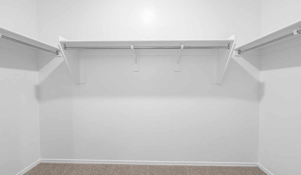 Discover The Easton at Saguaro Bloom in Marana, Arizona – a spacious 1,697 sq. ft. single-story new home designed to offer both style and functionality for today’s modern family.  As you enter through the front porch, you’re welcomed into a thoughtful layout that makes every square foot count. Near the front entrance is the first bedroom intentionally situated. This room can be utilized as a guest room, home office, or a cozy retreat.  Continuing down the hall you're welcomed into the great room, which flows seamlessly into the dining area and kitchen. This open-concept design ensures that the heart of the home is always connected. The kitchen is a culinary dream, featuring quartz countertops, a spacious island with a breakfast bar, and a walk-in pantry.  The great room opens up to a covered patio, an ideal space to unwind and enjoy beautiful desert sunsets. Whether you’re hosting a weekend barbecue or enjoying a quiet evening outdoors, this patio extends your living space into the scenic surroundings of Saguaro Bloom.  Just off the great room, a private hallway leads to the primary suite. The primary suite is generously sized and features a large walk-in closet, en-suite bathroom with walk-in shower, offering both privacy and convenience.  The Easton also features two additional bedrooms, well-positioned to share a full bathroom. These rooms are ideal for family members.  The Easton is designed with energy efficiency in mind and is DOE Zero Energy Ready Home Certified. This home includes a Connected® Smart Home package, featuring a smart thermostat, video doorbell, keyless entry, and Wi-Fi-enabled garage door opener. Energy efficiency is a cornerstone of the design, with features like spray foam insulation, and tankless water heater, offering long-term savings and sustainability.  Saguaro Bloom isn’t just a place to live, it’s a vibrant community with a wealth of amenities, from scenic walking trails to pools and playgrounds, ensuring that there’s always something for everyone.