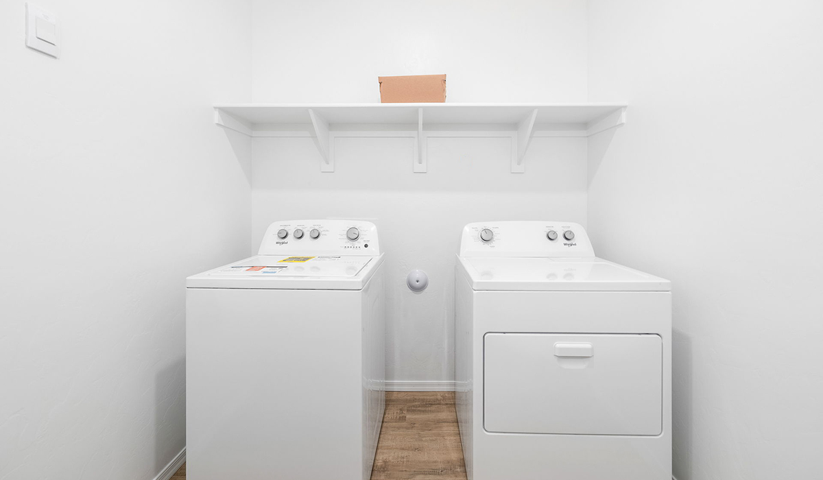 Discover The Easton at Saguaro Bloom in Marana, Arizona – a spacious 1,697 sq. ft. single-story new home designed to offer both style and functionality for today’s modern family.  As you enter through the front porch, you’re welcomed into a thoughtful layout that makes every square foot count. Near the front entrance is the first bedroom intentionally situated. This room can be utilized as a guest room, home office, or a cozy retreat.  Continuing down the hall you're welcomed into the great room, which flows seamlessly into the dining area and kitchen. This open-concept design ensures that the heart of the home is always connected. The kitchen is a culinary dream, featuring quartz countertops, a spacious island with a breakfast bar, and a walk-in pantry.  The great room opens up to a covered patio, an ideal space to unwind and enjoy beautiful desert sunsets. Whether you’re hosting a weekend barbecue or enjoying a quiet evening outdoors, this patio extends your living space into the scenic surroundings of Saguaro Bloom.  Just off the great room, a private hallway leads to the primary suite. The primary suite is generously sized and features a large walk-in closet, en-suite bathroom with walk-in shower, offering both privacy and convenience.  The Easton also features two additional bedrooms, well-positioned to share a full bathroom. These rooms are ideal for family members.  The Easton is designed with energy efficiency in mind and is DOE Zero Energy Ready Home Certified. This home includes a Connected® Smart Home package, featuring a smart thermostat, video doorbell, keyless entry, and Wi-Fi-enabled garage door opener. Energy efficiency is a cornerstone of the design, with features like spray foam insulation, and tankless water heater, offering long-term savings and sustainability.  Saguaro Bloom isn’t just a place to live, it’s a vibrant community with a wealth of amenities, from scenic walking trails to pools and playgrounds, ensuring that there’s always something for everyone.