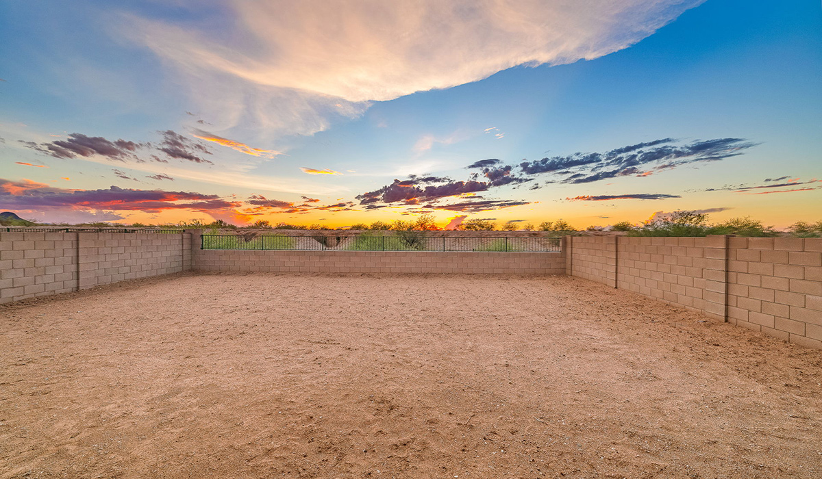 Discover The Easton at Saguaro Bloom in Marana, Arizona – a spacious 1,697 sq. ft. single-story new home designed to offer both style and functionality for today’s modern family.  As you enter through the front porch, you’re welcomed into a thoughtful layout that makes every square foot count. Near the front entrance is the first bedroom intentionally situated. This room can be utilized as a guest room, home office, or a cozy retreat.  Continuing down the hall you're welcomed into the great room, which flows seamlessly into the dining area and kitchen. This open-concept design ensures that the heart of the home is always connected. The kitchen is a culinary dream, featuring quartz countertops, a spacious island with a breakfast bar, and a walk-in pantry.  The great room opens up to a covered patio, an ideal space to unwind and enjoy beautiful desert sunsets. Whether you’re hosting a weekend barbecue or enjoying a quiet evening outdoors, this patio extends your living space into the scenic surroundings of Saguaro Bloom.  Just off the great room, a private hallway leads to the primary suite. The primary suite is generously sized and features a large walk-in closet, en-suite bathroom with walk-in shower, offering both privacy and convenience.  The Easton also features two additional bedrooms, well-positioned to share a full bathroom. These rooms are ideal for family members.  The Easton is designed with energy efficiency in mind and is DOE Zero Energy Ready Home Certified. This home includes a Connected® Smart Home package, featuring a smart thermostat, video doorbell, keyless entry, and Wi-Fi-enabled garage door opener. Energy efficiency is a cornerstone of the design, with features like spray foam insulation, and tankless water heater, offering long-term savings and sustainability.  Saguaro Bloom isn’t just a place to live, it’s a vibrant community with a wealth of amenities, from scenic walking trails to pools and playgrounds, ensuring that there’s always something for everyone.