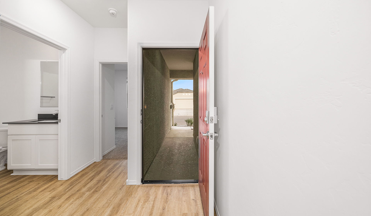 Discover The Easton at Saguaro Bloom in Marana, Arizona – a spacious 1,697 sq. ft. single-story new home designed to offer both style and functionality for today’s modern family.  As you enter through the front porch, you’re welcomed into a thoughtful layout that makes every square foot count. Near the front entrance is the first bedroom intentionally situated. This room can be utilized as a guest room, home office, or a cozy retreat.  Continuing down the hall you're welcomed into the great room, which flows seamlessly into the dining area and kitchen. This open-concept design ensures that the heart of the home is always connected. The kitchen is a culinary dream, featuring quartz countertops, a spacious island with a breakfast bar, and a walk-in pantry.  The great room opens up to a covered patio, an ideal space to unwind and enjoy beautiful desert sunsets. Whether you’re hosting a weekend barbecue or enjoying a quiet evening outdoors, this patio extends your living space into the scenic surroundings of Saguaro Bloom.  Just off the great room, a private hallway leads to the primary suite. The primary suite is generously sized and features a large walk-in closet, en-suite bathroom with walk-in shower, offering both privacy and convenience.  The Easton also features two additional bedrooms, well-positioned to share a full bathroom. These rooms are ideal for family members.  The Easton is designed with energy efficiency in mind and is DOE Zero Energy Ready Home Certified. This home includes a Connected® Smart Home package, featuring a smart thermostat, video doorbell, keyless entry, and Wi-Fi-enabled garage door opener. Energy efficiency is a cornerstone of the design, with features like spray foam insulation, and tankless water heater, offering long-term savings and sustainability.  Saguaro Bloom isn’t just a place to live, it’s a vibrant community with a wealth of amenities, from scenic walking trails to pools and playgrounds, ensuring that there’s always something for everyone.