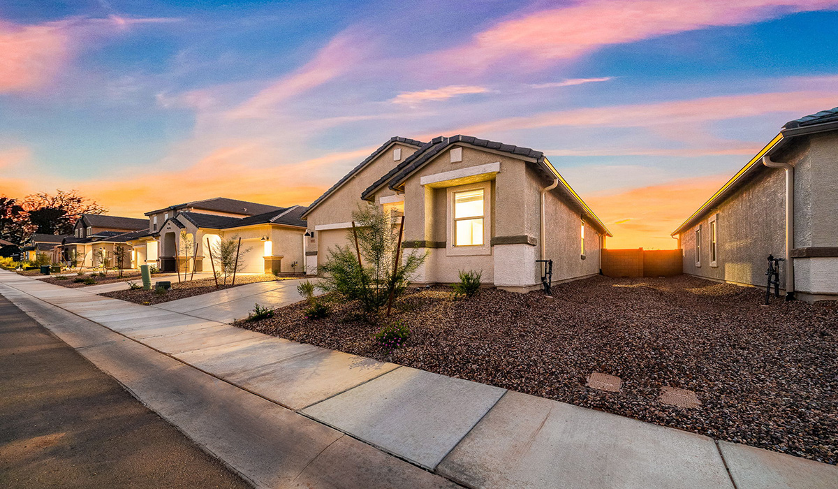 Discover The Easton at Saguaro Bloom in Marana, Arizona – a spacious 1,697 sq. ft. single-story new home designed to offer both style and functionality for today’s modern family.  As you enter through the front porch, you’re welcomed into a thoughtful layout that makes every square foot count. Near the front entrance is the first bedroom intentionally situated. This room can be utilized as a guest room, home office, or a cozy retreat.  Continuing down the hall you're welcomed into the great room, which flows seamlessly into the dining area and kitchen. This open-concept design ensures that the heart of the home is always connected. The kitchen is a culinary dream, featuring quartz countertops, a spacious island with a breakfast bar, and a walk-in pantry.  The great room opens up to a covered patio, an ideal space to unwind and enjoy beautiful desert sunsets. Whether you’re hosting a weekend barbecue or enjoying a quiet evening outdoors, this patio extends your living space into the scenic surroundings of Saguaro Bloom.  Just off the great room, a private hallway leads to the primary suite. The primary suite is generously sized and features a large walk-in closet, en-suite bathroom with walk-in shower, offering both privacy and convenience.  The Easton also features two additional bedrooms, well-positioned to share a full bathroom. These rooms are ideal for family members.  The Easton is designed with energy efficiency in mind and is DOE Zero Energy Ready Home Certified. This home includes a Connected® Smart Home package, featuring a smart thermostat, video doorbell, keyless entry, and Wi-Fi-enabled garage door opener. Energy efficiency is a cornerstone of the design, with features like spray foam insulation, and tankless water heater, offering long-term savings and sustainability.  Saguaro Bloom isn’t just a place to live, it’s a vibrant community with a wealth of amenities, from scenic walking trails to pools and playgrounds, ensuring that there’s always something for everyone.  *Images shown are for reference only. They depict The Easton spec home and may not represent the actual home.