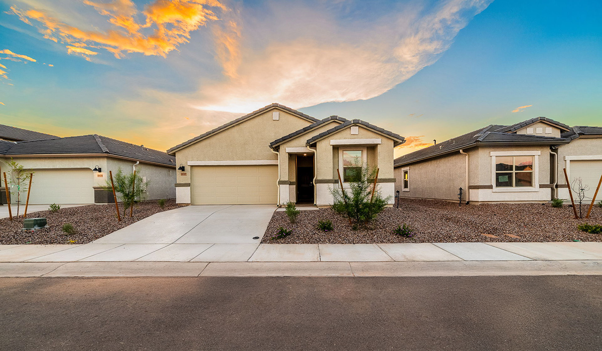 Discover The Easton at Saguaro Bloom in Marana, Arizona – a spacious 1,697 sq. ft. single-story new home designed to offer both style and functionality for today’s modern family.  As you enter through the front porch, you’re welcomed into a thoughtful layout that makes every square foot count. Near the front entrance is the first bedroom intentionally situated. This room can be utilized as a guest room, home office, or a cozy retreat.  Continuing down the hall you're welcomed into the great room, which flows seamlessly into the dining area and kitchen. This open-concept design ensures that the heart of the home is always connected. The kitchen is a culinary dream, featuring quartz countertops, a spacious island with a breakfast bar, and a walk-in pantry.  The great room opens up to a covered patio, an ideal space to unwind and enjoy beautiful desert sunsets. Whether you’re hosting a weekend barbecue or enjoying a quiet evening outdoors, this patio extends your living space into the scenic surroundings of Saguaro Bloom.  Just off the great room, a private hallway leads to the primary suite. The primary suite is generously sized and features a large walk-in closet, en-suite bathroom with walk-in shower, offering both privacy and convenience.  The Easton also features two additional bedrooms, well-positioned to share a full bathroom. These rooms are ideal for family members.  The Easton is designed with energy efficiency in mind and is DOE Zero Energy Ready Home Certified. This home includes a Connected® Smart Home package, featuring a smart thermostat, video doorbell, keyless entry, and Wi-Fi-enabled garage door opener. Energy efficiency is a cornerstone of the design, with features like spray foam insulation, and tankless water heater, offering long-term savings and sustainability.  Saguaro Bloom isn’t just a place to live, it’s a vibrant community with a wealth of amenities, from scenic walking trails to pools and playgrounds, ensuring that there’s always something for everyone.  *Images shown are for reference only. They depict The Easton spec home and may not represent the actual home.