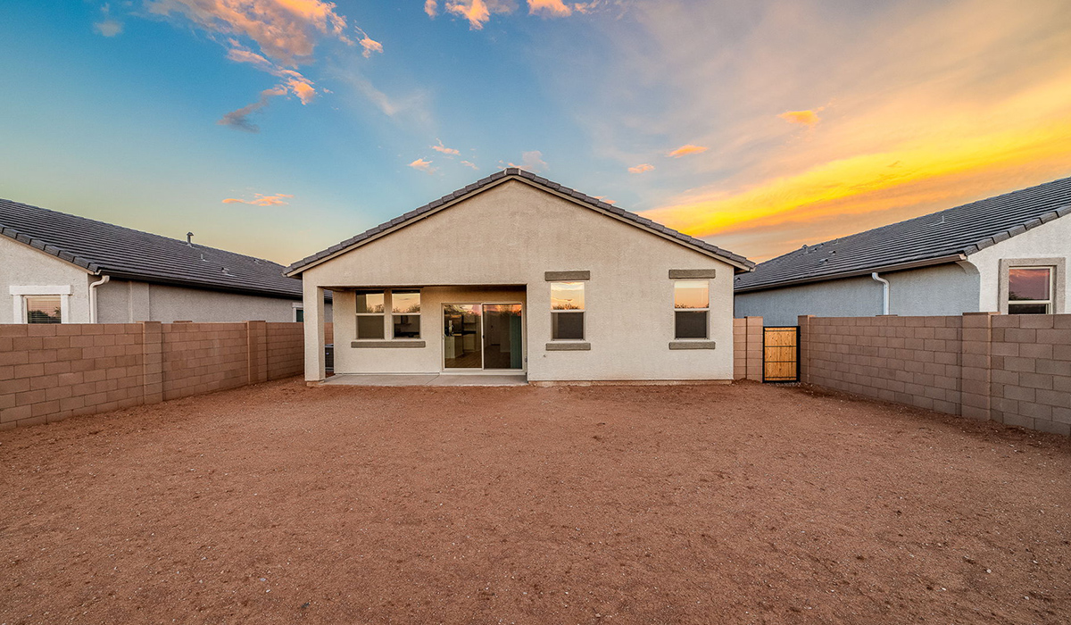 Discover The Easton at Saguaro Bloom in Marana, Arizona – a spacious 1,697 sq. ft. single-story new home designed to offer both style and functionality for today’s modern family.  As you enter through the front porch, you’re welcomed into a thoughtful layout that makes every square foot count. Near the front entrance is the first bedroom intentionally situated. This room can be utilized as a guest room, home office, or a cozy retreat.  Continuing down the hall you're welcomed into the great room, which flows seamlessly into the dining area and kitchen. This open-concept design ensures that the heart of the home is always connected. The kitchen is a culinary dream, featuring quartz countertops, a spacious island with a breakfast bar, and a walk-in pantry.  The great room opens up to a covered patio, an ideal space to unwind and enjoy beautiful desert sunsets. Whether you’re hosting a weekend barbecue or enjoying a quiet evening outdoors, this patio extends your living space into the scenic surroundings of Saguaro Bloom.  Just off the great room, a private hallway leads to the primary suite. The primary suite is generously sized and features a large walk-in closet, en-suite bathroom with walk-in shower, offering both privacy and convenience.  The Easton also features two additional bedrooms, well-positioned to share a full bathroom. These rooms are ideal for family members.  The Easton is designed with energy efficiency in mind and is DOE Zero Energy Ready Home Certified. This home includes a Connected® Smart Home package, featuring a smart thermostat, video doorbell, keyless entry, and Wi-Fi-enabled garage door opener. Energy efficiency is a cornerstone of the design, with features like spray foam insulation, and tankless water heater, offering long-term savings and sustainability.  Saguaro Bloom isn’t just a place to live, it’s a vibrant community with a wealth of amenities, from scenic walking trails to pools and playgrounds, ensuring that there’s always something for everyone.  *Images shown are for reference only. They depict The Easton spec home and may not represent the actual home.