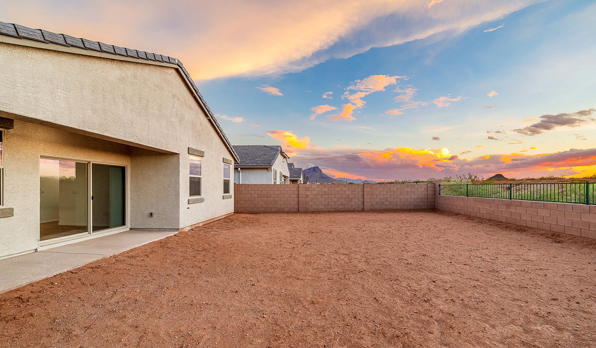 Discover The Easton at Saguaro Bloom in Marana, Arizona – a spacious 1,697 sq. ft. single-story new home designed to offer both style and functionality for today’s modern family.  As you enter through the front porch, you’re welcomed into a thoughtful layout that makes every square foot count. Near the front entrance is the first bedroom intentionally situated. This room can be utilized as a guest room, home office, or a cozy retreat.  Continuing down the hall you're welcomed into the great room, which flows seamlessly into the dining area and kitchen. This open-concept design ensures that the heart of the home is always connected. The kitchen is a culinary dream, featuring quartz countertops, a spacious island with a breakfast bar, and a walk-in pantry.  The great room opens up to a covered patio, an ideal space to unwind and enjoy beautiful desert sunsets. Whether you’re hosting a weekend barbecue or enjoying a quiet evening outdoors, this patio extends your living space into the scenic surroundings of Saguaro Bloom.  Just off the great room, a private hallway leads to the primary suite. The primary suite is generously sized and features a large walk-in closet, en-suite bathroom with walk-in shower, offering both privacy and convenience.  The Easton also features two additional bedrooms, well-positioned to share a full bathroom. These rooms are ideal for family members.  The Easton is designed with energy efficiency in mind and is DOE Zero Energy Ready Home Certified. This home includes a Connected® Smart Home package, featuring a smart thermostat, video doorbell, keyless entry, and Wi-Fi-enabled garage door opener. Energy efficiency is a cornerstone of the design, with features like spray foam insulation, and tankless water heater, offering long-term savings and sustainability.  Saguaro Bloom isn’t just a place to live, it’s a vibrant community with a wealth of amenities, from scenic walking trails to pools and playgrounds, ensuring that there’s always something for everyone.  *Images shown are for reference only. They depict The Easton spec home and may not represent the actual home.