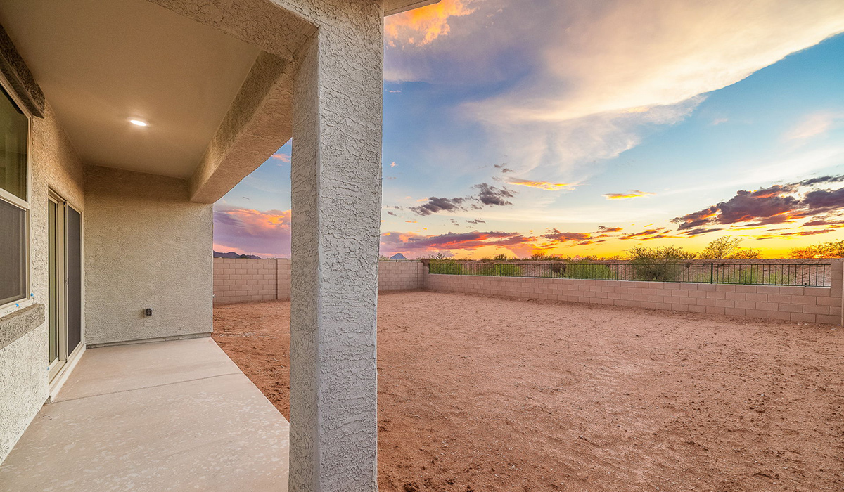 Discover The Easton at Saguaro Bloom in Marana, Arizona – a spacious 1,697 sq. ft. single-story new home designed to offer both style and functionality for today’s modern family.  As you enter through the front porch, you’re welcomed into a thoughtful layout that makes every square foot count. Near the front entrance is the first bedroom intentionally situated. This room can be utilized as a guest room, home office, or a cozy retreat.  Continuing down the hall you're welcomed into the great room, which flows seamlessly into the dining area and kitchen. This open-concept design ensures that the heart of the home is always connected. The kitchen is a culinary dream, featuring quartz countertops, a spacious island with a breakfast bar, and a walk-in pantry.  The great room opens up to a covered patio, an ideal space to unwind and enjoy beautiful desert sunsets. Whether you’re hosting a weekend barbecue or enjoying a quiet evening outdoors, this patio extends your living space into the scenic surroundings of Saguaro Bloom.  Just off the great room, a private hallway leads to the primary suite. The primary suite is generously sized and features a large walk-in closet, en-suite bathroom with walk-in shower, offering both privacy and convenience.  The Easton also features two additional bedrooms, well-positioned to share a full bathroom. These rooms are ideal for family members.  The Easton is designed with energy efficiency in mind and is DOE Zero Energy Ready Home Certified. This home includes a Connected® Smart Home package, featuring a smart thermostat, video doorbell, keyless entry, and Wi-Fi-enabled garage door opener. Energy efficiency is a cornerstone of the design, with features like spray foam insulation, and tankless water heater, offering long-term savings and sustainability.  Saguaro Bloom isn’t just a place to live, it’s a vibrant community with a wealth of amenities, from scenic walking trails to pools and playgrounds, ensuring that there’s always something for everyone.  *Images shown are for reference only. They depict The Easton spec home and may not represent the actual home.