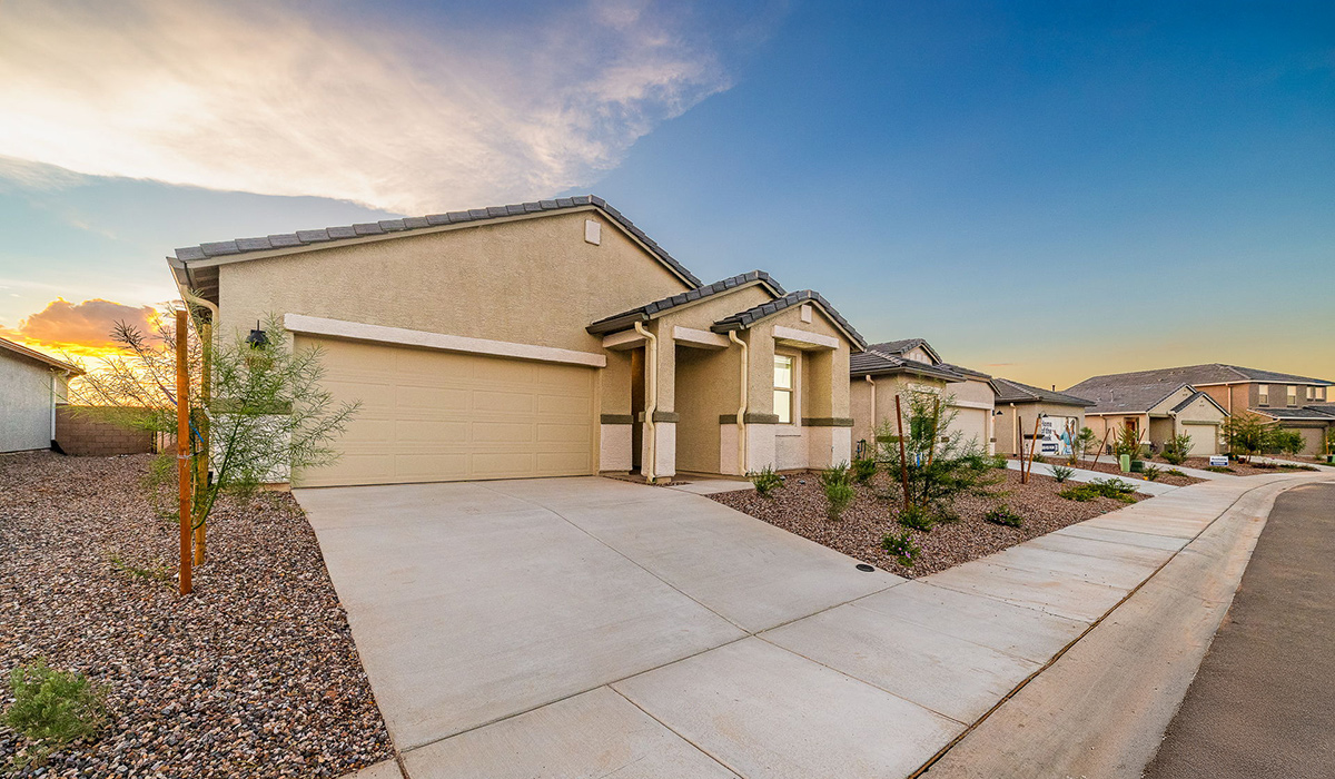 Discover The Easton at Saguaro Bloom in Marana, Arizona – a spacious 1,697 sq. ft. single-story new home designed to offer both style and functionality for today’s modern family.  As you enter through the front porch, you’re welcomed into a thoughtful layout that makes every square foot count. Near the front entrance is the first bedroom intentionally situated. This room can be utilized as a guest room, home office, or a cozy retreat.  Continuing down the hall you're welcomed into the great room, which flows seamlessly into the dining area and kitchen. This open-concept design ensures that the heart of the home is always connected. The kitchen is a culinary dream, featuring quartz countertops, a spacious island with a breakfast bar, and a walk-in pantry.  The great room opens up to a covered patio, an ideal space to unwind and enjoy beautiful desert sunsets. Whether you’re hosting a weekend barbecue or enjoying a quiet evening outdoors, this patio extends your living space into the scenic surroundings of Saguaro Bloom.  Just off the great room, a private hallway leads to the primary suite. The primary suite is generously sized and features a large walk-in closet, en-suite bathroom with walk-in shower, offering both privacy and convenience.  The Easton also features two additional bedrooms, well-positioned to share a full bathroom. These rooms are ideal for family members.  The Easton is designed with energy efficiency in mind and is DOE Zero Energy Ready Home Certified. This home includes a Connected® Smart Home package, featuring a smart thermostat, video doorbell, keyless entry, and Wi-Fi-enabled garage door opener. Energy efficiency is a cornerstone of the design, with features like spray foam insulation, and tankless water heater, offering long-term savings and sustainability.  Saguaro Bloom isn’t just a place to live, it’s a vibrant community with a wealth of amenities, from scenic walking trails to pools and playgrounds, ensuring that there’s always something for everyone.  *Images shown are for reference only. They depict The Easton spec home and may not represent the actual home.