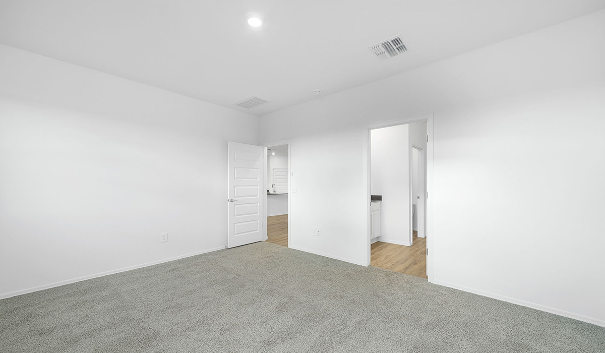 Discover The Easton at Saguaro Bloom in Marana, Arizona – a spacious 1,697 sq. ft. single-story new home designed to offer both style and functionality for today’s modern family.  As you enter through the front porch, you’re welcomed into a thoughtful layout that makes every square foot count. Near the front entrance is the first bedroom intentionally situated. This room can be utilized as a guest room, home office, or a cozy retreat.  Continuing down the hall you're welcomed into the great room, which flows seamlessly into the dining area and kitchen. This open-concept design ensures that the heart of the home is always connected. The kitchen is a culinary dream, featuring quartz countertops, a spacious island with a breakfast bar, and a walk-in pantry.  The great room opens up to a covered patio, an ideal space to unwind and enjoy beautiful desert sunsets. Whether you’re hosting a weekend barbecue or enjoying a quiet evening outdoors, this patio extends your living space into the scenic surroundings of Saguaro Bloom.  Just off the great room, a private hallway leads to the primary suite. The primary suite is generously sized and features a large walk-in closet, en-suite bathroom with walk-in shower, offering both privacy and convenience.  The Easton also features two additional bedrooms, well-positioned to share a full bathroom. These rooms are ideal for family members.  The Easton is designed with energy efficiency in mind and is DOE Zero Energy Ready Home Certified. This home includes a Connected® Smart Home package, featuring a smart thermostat, video doorbell, keyless entry, and Wi-Fi-enabled garage door opener. Energy efficiency is a cornerstone of the design, with features like spray foam insulation, and tankless water heater, offering long-term savings and sustainability.  Saguaro Bloom isn’t just a place to live, it’s a vibrant community with a wealth of amenities, from scenic walking trails to pools and playgrounds, ensuring that there’s always something for everyone.