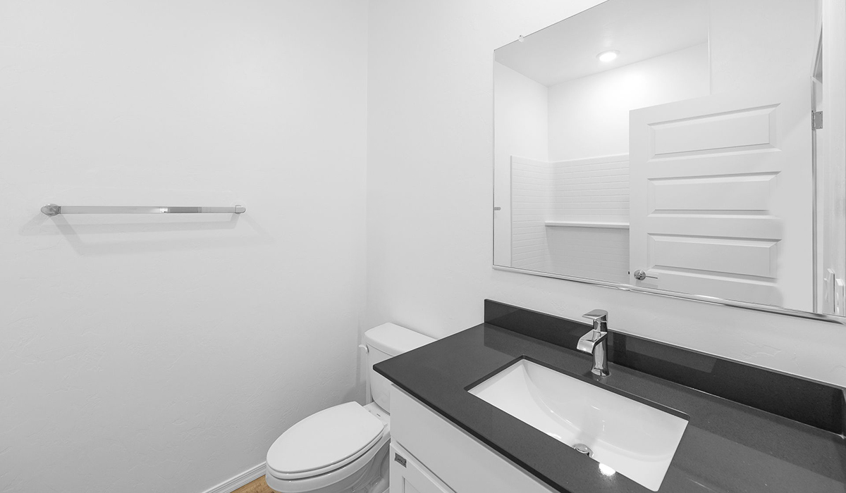 Discover The Easton at Saguaro Bloom in Marana, Arizona – a spacious 1,697 sq. ft. single-story new home designed to offer both style and functionality for today’s modern family.  As you enter through the front porch, you’re welcomed into a thoughtful layout that makes every square foot count. Near the front entrance is the first bedroom intentionally situated. This room can be utilized as a guest room, home office, or a cozy retreat.  Continuing down the hall you're welcomed into the great room, which flows seamlessly into the dining area and kitchen. This open-concept design ensures that the heart of the home is always connected. The kitchen is a culinary dream, featuring quartz countertops, a spacious island with a breakfast bar, and a walk-in pantry.  The great room opens up to a covered patio, an ideal space to unwind and enjoy beautiful desert sunsets. Whether you’re hosting a weekend barbecue or enjoying a quiet evening outdoors, this patio extends your living space into the scenic surroundings of Saguaro Bloom.  Just off the great room, a private hallway leads to the primary suite. The primary suite is generously sized and features a large walk-in closet, en-suite bathroom with walk-in shower, offering both privacy and convenience.  The Easton also features two additional bedrooms, well-positioned to share a full bathroom. These rooms are ideal for family members.  The Easton is designed with energy efficiency in mind and is DOE Zero Energy Ready Home Certified. This home includes a Connected® Smart Home package, featuring a smart thermostat, video doorbell, keyless entry, and Wi-Fi-enabled garage door opener. Energy efficiency is a cornerstone of the design, with features like spray foam insulation, and tankless water heater, offering long-term savings and sustainability.  Saguaro Bloom isn’t just a place to live, it’s a vibrant community with a wealth of amenities, from scenic walking trails to pools and playgrounds, ensuring that there’s always something for everyone.