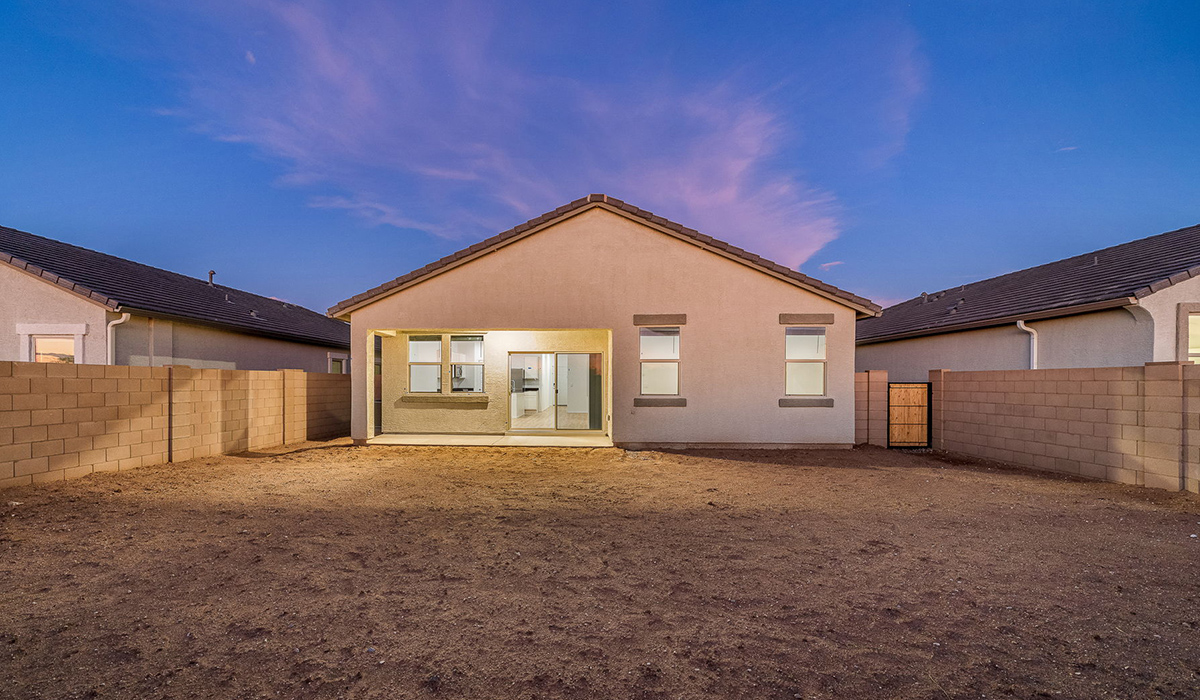 Discover The Easton at Saguaro Bloom in Marana, Arizona – a spacious 1,697 sq. ft. single-story new home designed to offer both style and functionality for today’s modern family.  As you enter through the front porch, you’re welcomed into a thoughtful layout that makes every square foot count. Near the front entrance is the first bedroom intentionally situated. This room can be utilized as a guest room, home office, or a cozy retreat.  Continuing down the hall you're welcomed into the great room, which flows seamlessly into the dining area and kitchen. This open-concept design ensures that the heart of the home is always connected. The kitchen is a culinary dream, featuring quartz countertops, a spacious island with a breakfast bar, and a walk-in pantry.  The great room opens up to a covered patio, an ideal space to unwind and enjoy beautiful desert sunsets. Whether you’re hosting a weekend barbecue or enjoying a quiet evening outdoors, this patio extends your living space into the scenic surroundings of Saguaro Bloom.  Just off the great room, a private hallway leads to the primary suite. The primary suite is generously sized and features a large walk-in closet, en-suite bathroom with walk-in shower, offering both privacy and convenience.  The Easton also features two additional bedrooms, well-positioned to share a full bathroom. These rooms are ideal for family members.  The Easton is designed with energy efficiency in mind and is DOE Zero Energy Ready Home Certified. This home includes a Connected® Smart Home package, featuring a smart thermostat, video doorbell, keyless entry, and Wi-Fi-enabled garage door opener. Energy efficiency is a cornerstone of the design, with features like spray foam insulation, and tankless water heater, offering long-term savings and sustainability.  Saguaro Bloom isn’t just a place to live, it’s a vibrant community with a wealth of amenities, from scenic walking trails to pools and playgrounds, ensuring that there’s always something for everyone.