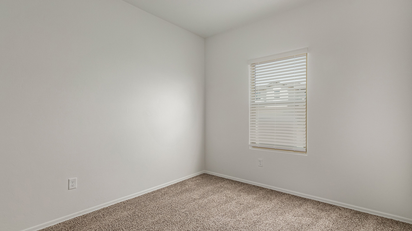 Discover The Easton at Saguaro Bloom in Marana, Arizona – a spacious 1,697 sq. ft. single-story new home designed to offer both style and functionality for today’s modern family.  As you enter through the front porch, you’re welcomed into a thoughtful layout that makes every square foot count. Near the front entrance is the first bedroom intentionally situated. This room can be utilized as a guest room, home office, or a cozy retreat.  Continuing down the hall you're welcomed into the great room, which flows seamlessly into the dining area and kitchen. This open-concept design ensures that the heart of the home is always connected. The kitchen is a culinary dream, featuring quartz countertops, a spacious island with a breakfast bar, and a walk-in pantry.  The great room opens up to a covered patio, an ideal space to unwind and enjoy beautiful desert sunsets. Whether you’re hosting a weekend barbecue or enjoying a quiet evening outdoors, this patio extends your living space into the scenic surroundings of Saguaro Bloom.  Just off the great room, a private hallway leads to the primary suite. The primary suite is generously sized and features a large walk-in closet, en-suite bathroom with walk-in shower, offering both privacy and convenience.  The Easton also features two additional bedrooms, well-positioned to share a full bathroom. These rooms are ideal for family members.  The Easton is designed with energy efficiency in mind and is DOE Zero Energy Ready Home Certified. This home includes a Connected® Smart Home package, featuring a smart thermostat, video doorbell, keyless entry, and Wi-Fi-enabled garage door opener. Energy efficiency is a cornerstone of the design, with features like spray foam insulation, and tankless water heater, offering long-term savings and sustainability.  Saguaro Bloom isn’t just a place to live, it’s a vibrant community with a wealth of amenities, from scenic walking trails to pools and playgrounds, ensuring that there’s always something for everyone.