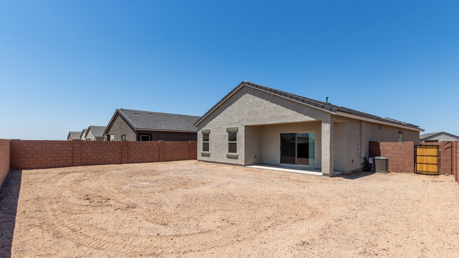 Discover The Easton at Saguaro Bloom in Marana, Arizona – a spacious 1,697 sq. ft. single-story new home designed to offer both style and functionality for today’s modern family.  As you enter through the front porch, you’re welcomed into a thoughtful layout that makes every square foot count. Near the front entrance is the first bedroom intentionally situated. This room can be utilized as a guest room, home office, or a cozy retreat.  Continuing down the hall you're welcomed into the great room, which flows seamlessly into the dining area and kitchen. This open-concept design ensures that the heart of the home is always connected. The kitchen is a culinary dream, featuring quartz countertops, a spacious island with a breakfast bar, and a walk-in pantry.  The great room opens up to a covered patio, an ideal space to unwind and enjoy beautiful desert sunsets. Whether you’re hosting a weekend barbecue or enjoying a quiet evening outdoors, this patio extends your living space into the scenic surroundings of Saguaro Bloom.  Just off the great room, a private hallway leads to the primary suite. The primary suite is generously sized and features a large walk-in closet, en-suite bathroom with walk-in shower, offering both privacy and convenience.  The Easton also features two additional bedrooms, well-positioned to share a full bathroom. These rooms are ideal for family members.  The Easton is designed with energy efficiency in mind and is DOE Zero Energy Ready Home Certified. This home includes a Connected® Smart Home package, featuring a smart thermostat, video doorbell, keyless entry, and Wi-Fi-enabled garage door opener. Energy efficiency is a cornerstone of the design, with features like spray foam insulation, and tankless water heater, offering long-term savings and sustainability.  Saguaro Bloom isn’t just a place to live, it’s a vibrant community with a wealth of amenities, from scenic walking trails to pools and playgrounds, ensuring that there’s always something for everyone.