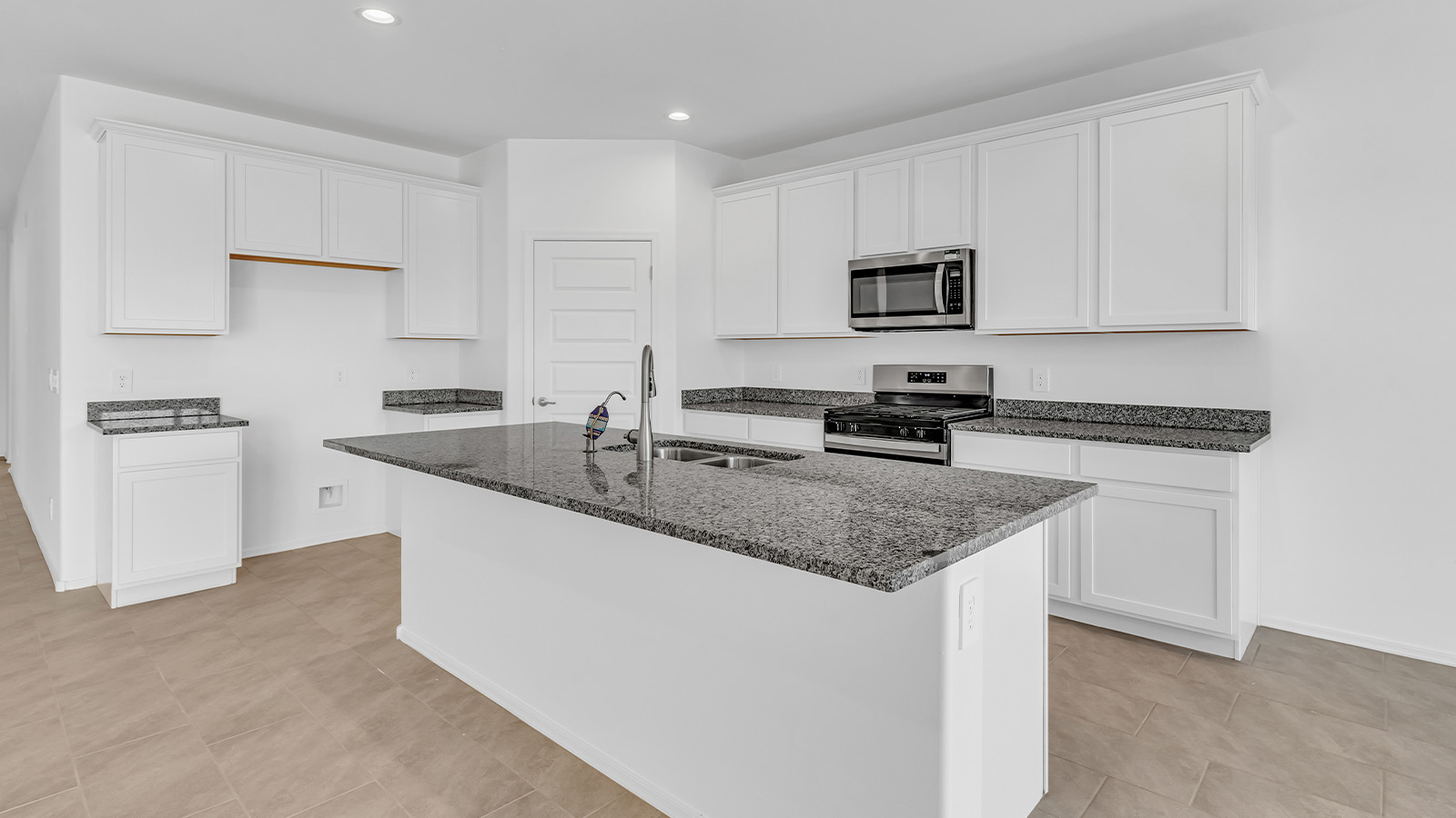 Welcome to The Pearl, a beautifully designed single-story new home located in the serene Cholla Ridge neighborhood of Saguaro Bloom. Spanning 2,431 square feet, this home offers four spacious bedrooms and three full bathrooms, making it an ideal choice for families who value both space and comfort.  As you enter through the front porch, you’re welcomed into a bright and open entryway that leads to the heart of the home. The expansive great room, dining area, and kitchen are seamlessly connected, providing a perfect setting for both everyday living and entertaining. The kitchen is a chef’s delight, featuring a large island, granite countertops, and Shaker-style cabinetry in double espresso. With a generously sized pantry and modern stainless steel gas appliances, this kitchen is both functional and stylish.  The Pearl’s layout includes a well-placed primary bedroom at the rear of the home, ensuring privacy and tranquility. The primary suite features a spacious walk-in closet and an en-suite bathroom with dual executive-height vanities and a large walk-in shower. The additional three bedrooms are located towards the front and sides of the home, each offering ample closet space and access to two full bathrooms, making this layout perfect for families and guests alike.  The outdoor living space is just as inviting, with a covered patio that extends from the great room, providing an ideal spot for enjoying Arizona’s beautiful weather. Whether you’re hosting a gathering or simply relaxing with a good book, this space is designed for your enjoyment.  The Pearl also features a dedicated utility room near the kitchen, making household tasks more convenient. A two-car garage offers plenty of space for vehicles and additional storage.  Built with energy efficiency and modern living in mind, The Pearl incorporates eco-friendly features and smart home technology, ensuring a comfortable and sustainable lifestyle. Large windows throughout the home allow natural light to flood the space, creating a warm and inviting atmosphere.  Located within the exclusive Cholla Ridge neighborhood at Saguaro Bloom, residents of The Pearl enjoy a range of amenities, including beautiful 12x24” tile flooring, and gourmet kitchens in select homes, all on lots with no rear neighbors. The community offers access to two pools, walking trails, and parks, all set against the stunning backdrop of the Tucson Mountains.  The Pearl combines style, comfort, and practicality, making it a perfect place to call home in one of Marana’s most sought-after communities.