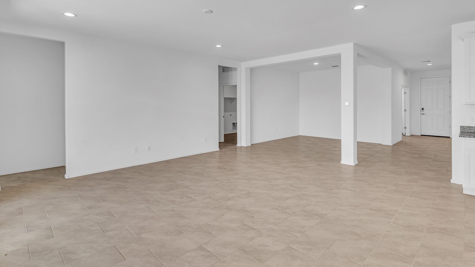 Welcome to The Pearl, a beautifully designed single-story new home located in the serene Cholla Ridge neighborhood of Saguaro Bloom. Spanning 2,431 square feet, this home offers four spacious bedrooms and three full bathrooms, making it an ideal choice for families who value both space and comfort.  As you enter through the front porch, you’re welcomed into a bright and open entryway that leads to the heart of the home. The expansive great room, dining area, and kitchen are seamlessly connected, providing a perfect setting for both everyday living and entertaining. The kitchen is a chef’s delight, featuring a large island, granite countertops, and Shaker-style cabinetry in double espresso. With a generously sized pantry and modern stainless steel gas appliances, this kitchen is both functional and stylish.  The Pearl’s layout includes a well-placed primary bedroom at the rear of the home, ensuring privacy and tranquility. The primary suite features a spacious walk-in closet and an en-suite bathroom with dual executive-height vanities and a large walk-in shower. The additional three bedrooms are located towards the front and sides of the home, each offering ample closet space and access to two full bathrooms, making this layout perfect for families and guests alike.  The outdoor living space is just as inviting, with a covered patio that extends from the great room, providing an ideal spot for enjoying Arizona’s beautiful weather. Whether you’re hosting a gathering or simply relaxing with a good book, this space is designed for your enjoyment.  The Pearl also features a dedicated utility room near the kitchen, making household tasks more convenient. A two-car garage offers plenty of space for vehicles and additional storage.  Built with energy efficiency and modern living in mind, The Pearl incorporates eco-friendly features and smart home technology, ensuring a comfortable and sustainable lifestyle. Large windows throughout the home allow natural light to flood the space, creating a warm and inviting atmosphere.  Located within the exclusive Cholla Ridge neighborhood at Saguaro Bloom, residents of The Pearl enjoy a range of amenities, including beautiful 12x24” tile flooring, and gourmet kitchens in select homes, all on lots with no rear neighbors. The community offers access to two pools, walking trails, and parks, all set against the stunning backdrop of the Tucson Mountains.  The Pearl combines style, comfort, and practicality, making it a perfect place to call home in one of Marana’s most sought-after communities.