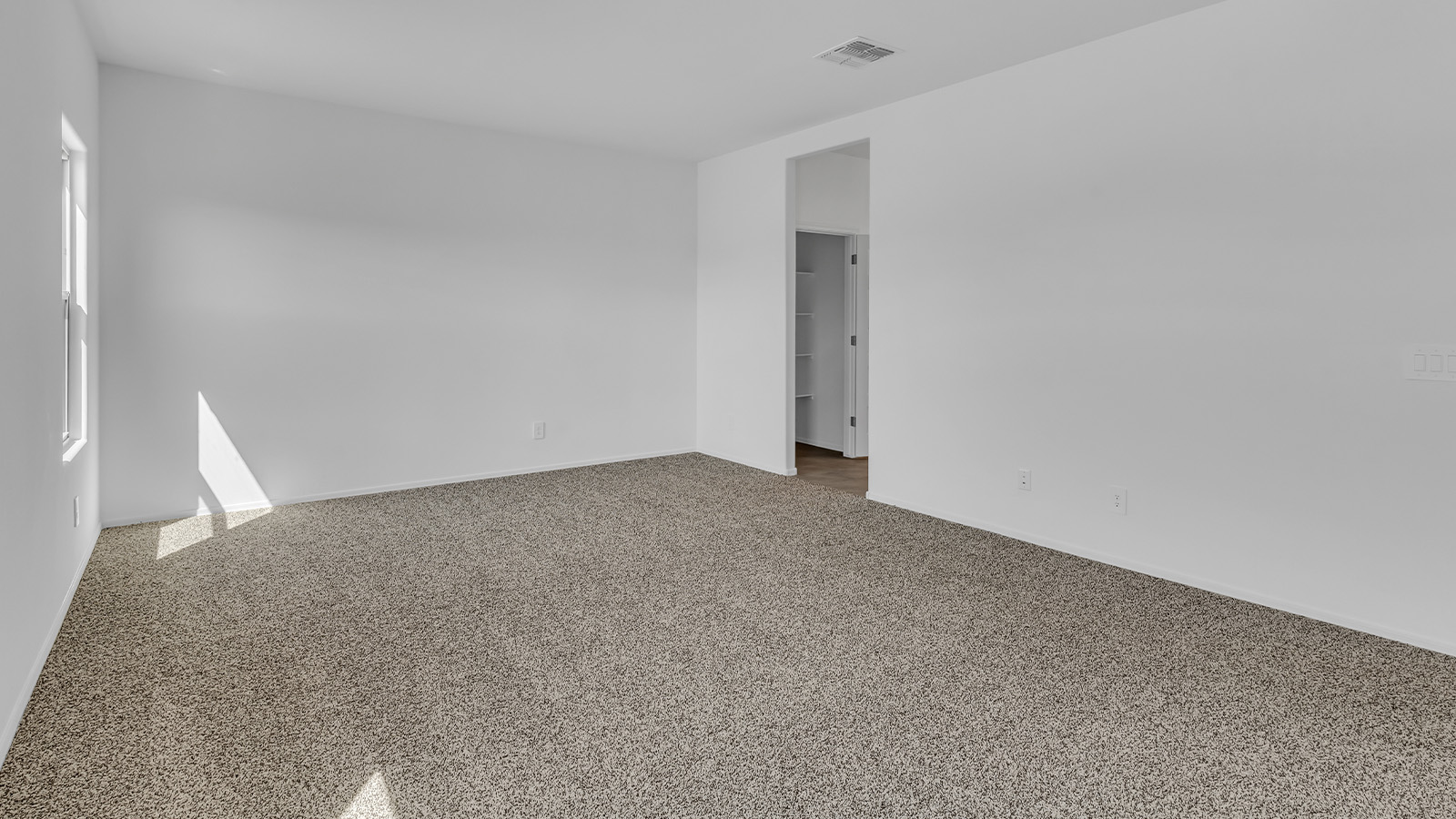 Welcome to The Pearl, a beautifully designed single-story new home located in the serene Cholla Ridge neighborhood of Saguaro Bloom. Spanning 2,431 square feet, this home offers four spacious bedrooms and three full bathrooms, making it an ideal choice for families who value both space and comfort.  As you enter through the front porch, you’re welcomed into a bright and open entryway that leads to the heart of the home. The expansive great room, dining area, and kitchen are seamlessly connected, providing a perfect setting for both everyday living and entertaining. The kitchen is a chef’s delight, featuring a large island, granite countertops, and Shaker-style cabinetry in double espresso. With a generously sized pantry and modern stainless steel gas appliances, this kitchen is both functional and stylish.  The Pearl’s layout includes a well-placed primary bedroom at the rear of the home, ensuring privacy and tranquility. The primary suite features a spacious walk-in closet and an en-suite bathroom with dual executive-height vanities and a large walk-in shower. The additional three bedrooms are located towards the front and sides of the home, each offering ample closet space and access to two full bathrooms, making this layout perfect for families and guests alike.  The outdoor living space is just as inviting, with a covered patio that extends from the great room, providing an ideal spot for enjoying Arizona’s beautiful weather. Whether you’re hosting a gathering or simply relaxing with a good book, this space is designed for your enjoyment.  The Pearl also features a dedicated utility room near the kitchen, making household tasks more convenient. A two-car garage offers plenty of space for vehicles and additional storage.  Built with energy efficiency and modern living in mind, The Pearl incorporates eco-friendly features and smart home technology, ensuring a comfortable and sustainable lifestyle. Large windows throughout the home allow natural light to flood the space, creating a warm and inviting atmosphere.  Located within the exclusive Cholla Ridge neighborhood at Saguaro Bloom, residents of The Pearl enjoy a range of amenities, including beautiful 12x24” tile flooring, and gourmet kitchens in select homes, all on lots with no rear neighbors. The community offers access to two pools, walking trails, and parks, all set against the stunning backdrop of the Tucson Mountains.  The Pearl combines style, comfort, and practicality, making it a perfect place to call home in one of Marana’s most sought-after communities.