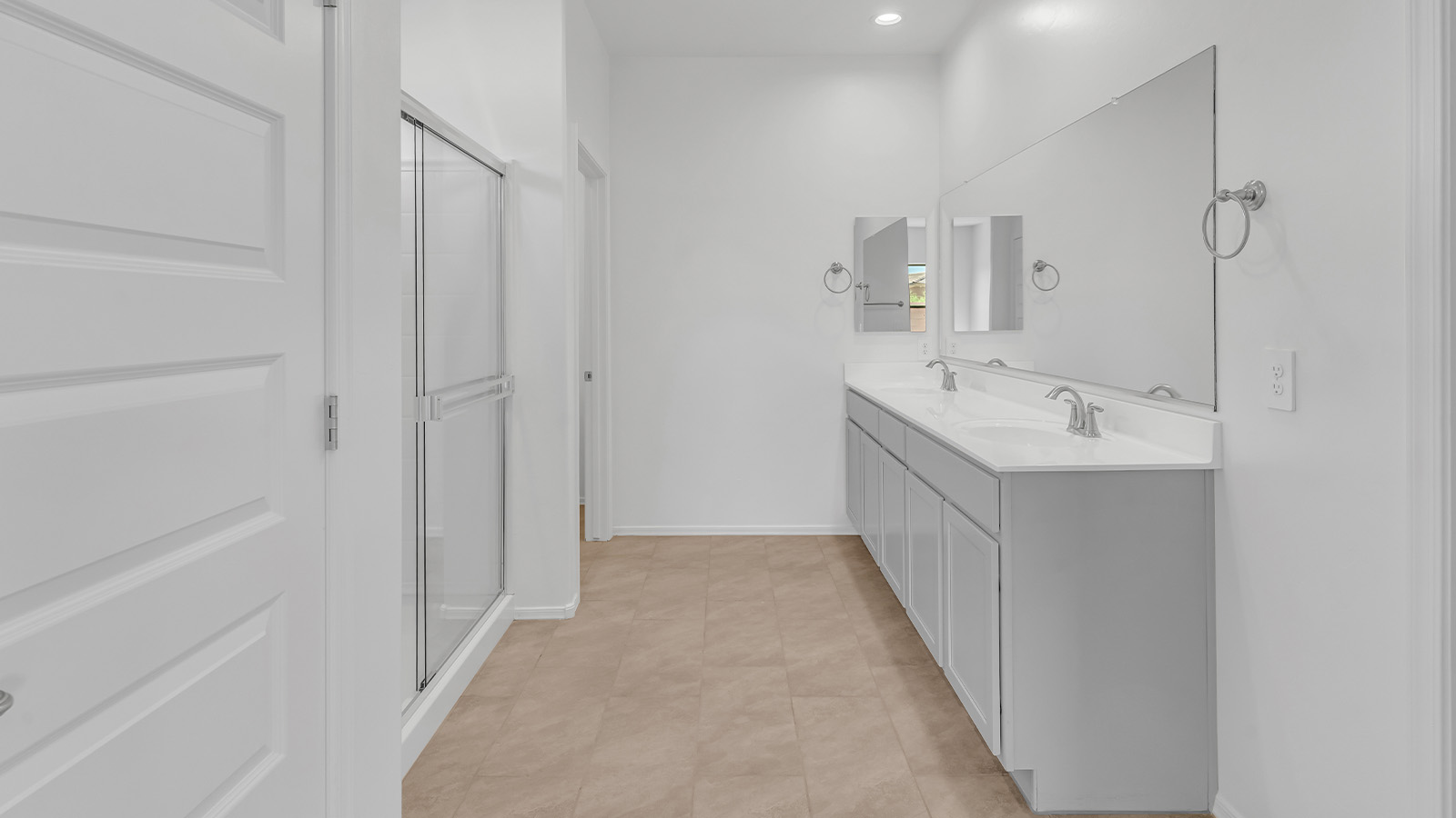 Welcome to The Pearl, a beautifully designed single-story new home located in the serene Cholla Ridge neighborhood of Saguaro Bloom. Spanning 2,431 square feet, this home offers four spacious bedrooms and three full bathrooms, making it an ideal choice for families who value both space and comfort.  As you enter through the front porch, you’re welcomed into a bright and open entryway that leads to the heart of the home. The expansive great room, dining area, and kitchen are seamlessly connected, providing a perfect setting for both everyday living and entertaining. The kitchen is a chef’s delight, featuring a large island, granite countertops, and Shaker-style cabinetry in double espresso. With a generously sized pantry and modern stainless steel gas appliances, this kitchen is both functional and stylish.  The Pearl’s layout includes a well-placed primary bedroom at the rear of the home, ensuring privacy and tranquility. The primary suite features a spacious walk-in closet and an en-suite bathroom with dual executive-height vanities and a large walk-in shower. The additional three bedrooms are located towards the front and sides of the home, each offering ample closet space and access to two full bathrooms, making this layout perfect for families and guests alike.  The outdoor living space is just as inviting, with a covered patio that extends from the great room, providing an ideal spot for enjoying Arizona’s beautiful weather. Whether you’re hosting a gathering or simply relaxing with a good book, this space is designed for your enjoyment.  The Pearl also features a dedicated utility room near the kitchen, making household tasks more convenient. A two-car garage offers plenty of space for vehicles and additional storage.  Built with energy efficiency and modern living in mind, The Pearl incorporates eco-friendly features and smart home technology, ensuring a comfortable and sustainable lifestyle. Large windows throughout the home allow natural light to flood the space, creating a warm and inviting atmosphere.  Located within the exclusive Cholla Ridge neighborhood at Saguaro Bloom, residents of The Pearl enjoy a range of amenities, including beautiful 12x24” tile flooring, and gourmet kitchens in select homes, all on lots with no rear neighbors. The community offers access to two pools, walking trails, and parks, all set against the stunning backdrop of the Tucson Mountains.  The Pearl combines style, comfort, and practicality, making it a perfect place to call home in one of Marana’s most sought-after communities.