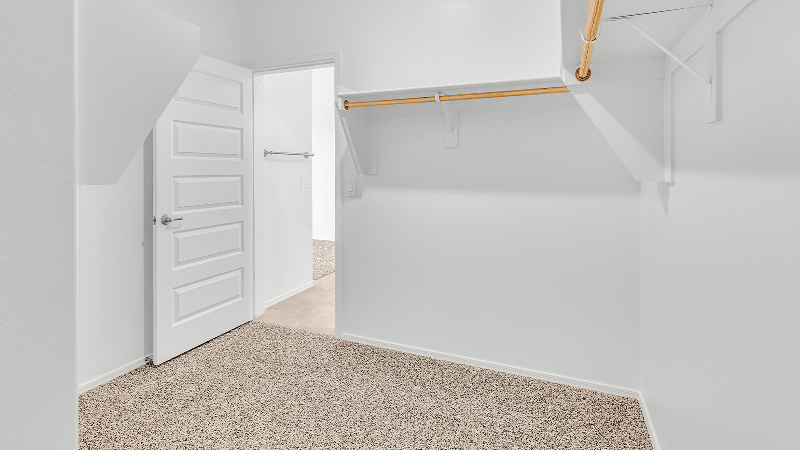 Welcome to The Pearl, a beautifully designed single-story new home located in the serene Cholla Ridge neighborhood of Saguaro Bloom. Spanning 2,431 square feet, this home offers four spacious bedrooms and three full bathrooms, making it an ideal choice for families who value both space and comfort.  As you enter through the front porch, you’re welcomed into a bright and open entryway that leads to the heart of the home. The expansive great room, dining area, and kitchen are seamlessly connected, providing a perfect setting for both everyday living and entertaining. The kitchen is a chef’s delight, featuring a large island, granite countertops, and Shaker-style cabinetry in double espresso. With a generously sized pantry and modern stainless steel gas appliances, this kitchen is both functional and stylish.  The Pearl’s layout includes a well-placed primary bedroom at the rear of the home, ensuring privacy and tranquility. The primary suite features a spacious walk-in closet and an en-suite bathroom with dual executive-height vanities and a large walk-in shower. The additional three bedrooms are located towards the front and sides of the home, each offering ample closet space and access to two full bathrooms, making this layout perfect for families and guests alike.  The outdoor living space is just as inviting, with a covered patio that extends from the great room, providing an ideal spot for enjoying Arizona’s beautiful weather. Whether you’re hosting a gathering or simply relaxing with a good book, this space is designed for your enjoyment.  The Pearl also features a dedicated utility room near the kitchen, making household tasks more convenient. A two-car garage offers plenty of space for vehicles and additional storage.  Built with energy efficiency and modern living in mind, The Pearl incorporates eco-friendly features and smart home technology, ensuring a comfortable and sustainable lifestyle. Large windows throughout the home allow natural light to flood the space, creating a warm and inviting atmosphere.  Located within the exclusive Cholla Ridge neighborhood at Saguaro Bloom, residents of The Pearl enjoy a range of amenities, including beautiful 12x24” tile flooring, and gourmet kitchens in select homes, all on lots with no rear neighbors. The community offers access to two pools, walking trails, and parks, all set against the stunning backdrop of the Tucson Mountains.  The Pearl combines style, comfort, and practicality, making it a perfect place to call home in one of Marana’s most sought-after communities.