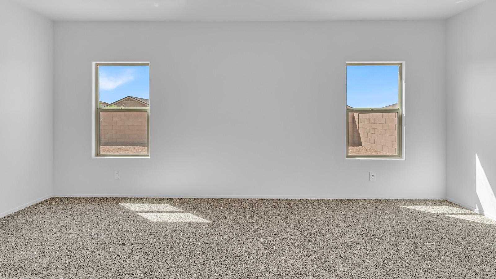 Welcome to The Pearl, a beautifully designed single-story new home located in the serene Cholla Ridge neighborhood of Saguaro Bloom. Spanning 2,431 square feet, this home offers four spacious bedrooms and three full bathrooms, making it an ideal choice for families who value both space and comfort.  As you enter through the front porch, you’re welcomed into a bright and open entryway that leads to the heart of the home. The expansive great room, dining area, and kitchen are seamlessly connected, providing a perfect setting for both everyday living and entertaining. The kitchen is a chef’s delight, featuring a large island, granite countertops, and Shaker-style cabinetry in double espresso. With a generously sized pantry and modern stainless steel gas appliances, this kitchen is both functional and stylish.  The Pearl’s layout includes a well-placed primary bedroom at the rear of the home, ensuring privacy and tranquility. The primary suite features a spacious walk-in closet and an en-suite bathroom with dual executive-height vanities and a large walk-in shower. The additional three bedrooms are located towards the front and sides of the home, each offering ample closet space and access to two full bathrooms, making this layout perfect for families and guests alike.  The outdoor living space is just as inviting, with a covered patio that extends from the great room, providing an ideal spot for enjoying Arizona’s beautiful weather. Whether you’re hosting a gathering or simply relaxing with a good book, this space is designed for your enjoyment.  The Pearl also features a dedicated utility room near the kitchen, making household tasks more convenient. A two-car garage offers plenty of space for vehicles and additional storage.  Built with energy efficiency and modern living in mind, The Pearl incorporates eco-friendly features and smart home technology, ensuring a comfortable and sustainable lifestyle. Large windows throughout the home allow natural light to flood the space, creating a warm and inviting atmosphere.  Located within the exclusive Cholla Ridge neighborhood at Saguaro Bloom, residents of The Pearl enjoy a range of amenities, including beautiful 12x24” tile flooring, and gourmet kitchens in select homes, all on lots with no rear neighbors. The community offers access to two pools, walking trails, and parks, all set against the stunning backdrop of the Tucson Mountains.  The Pearl combines style, comfort, and practicality, making it a perfect place to call home in one of Marana’s most sought-after communities.